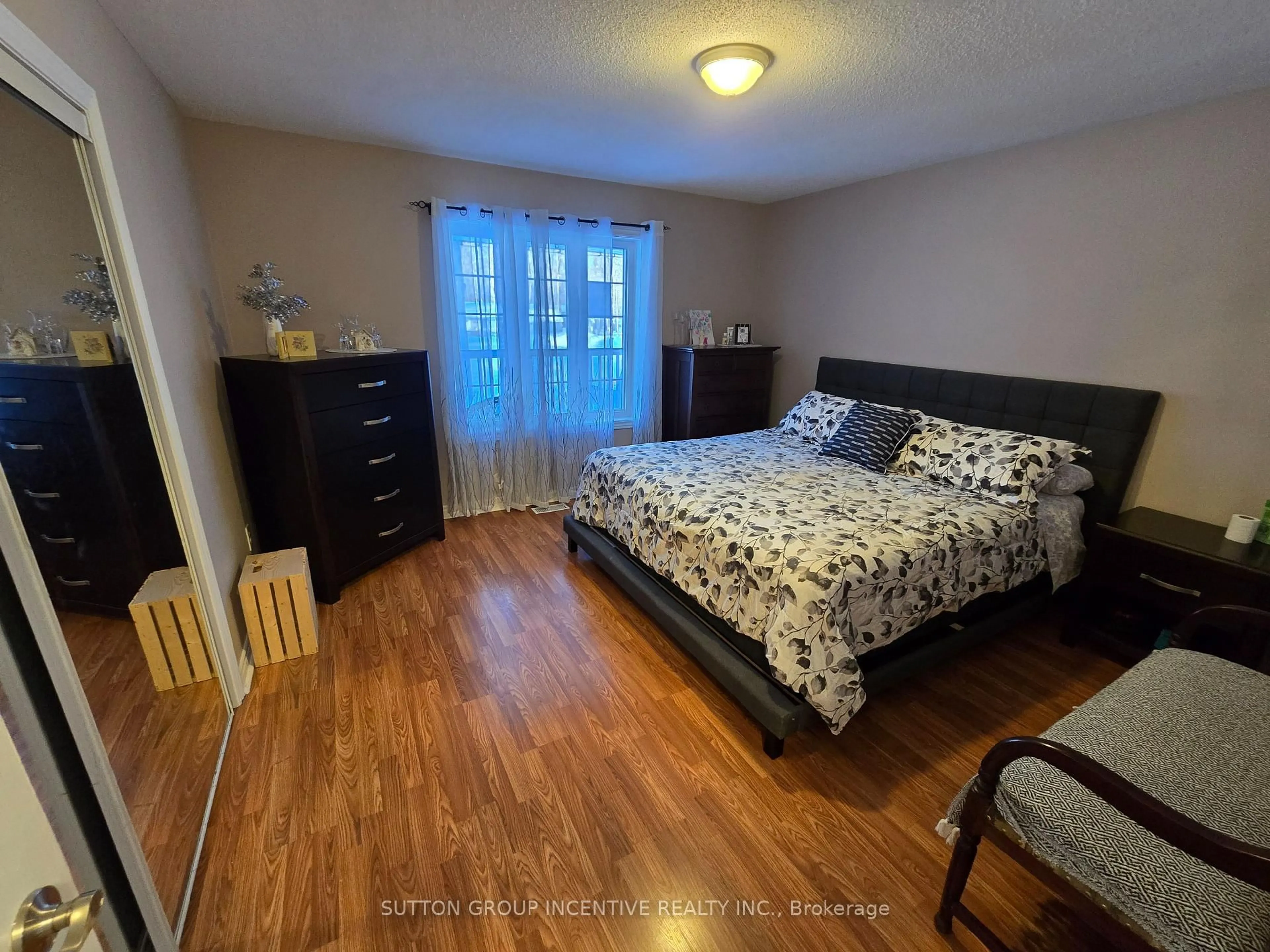 Bedroom with bed, wood/laminate floor for 113 Desroches Tr, Tiny Ontario L0M 0H9