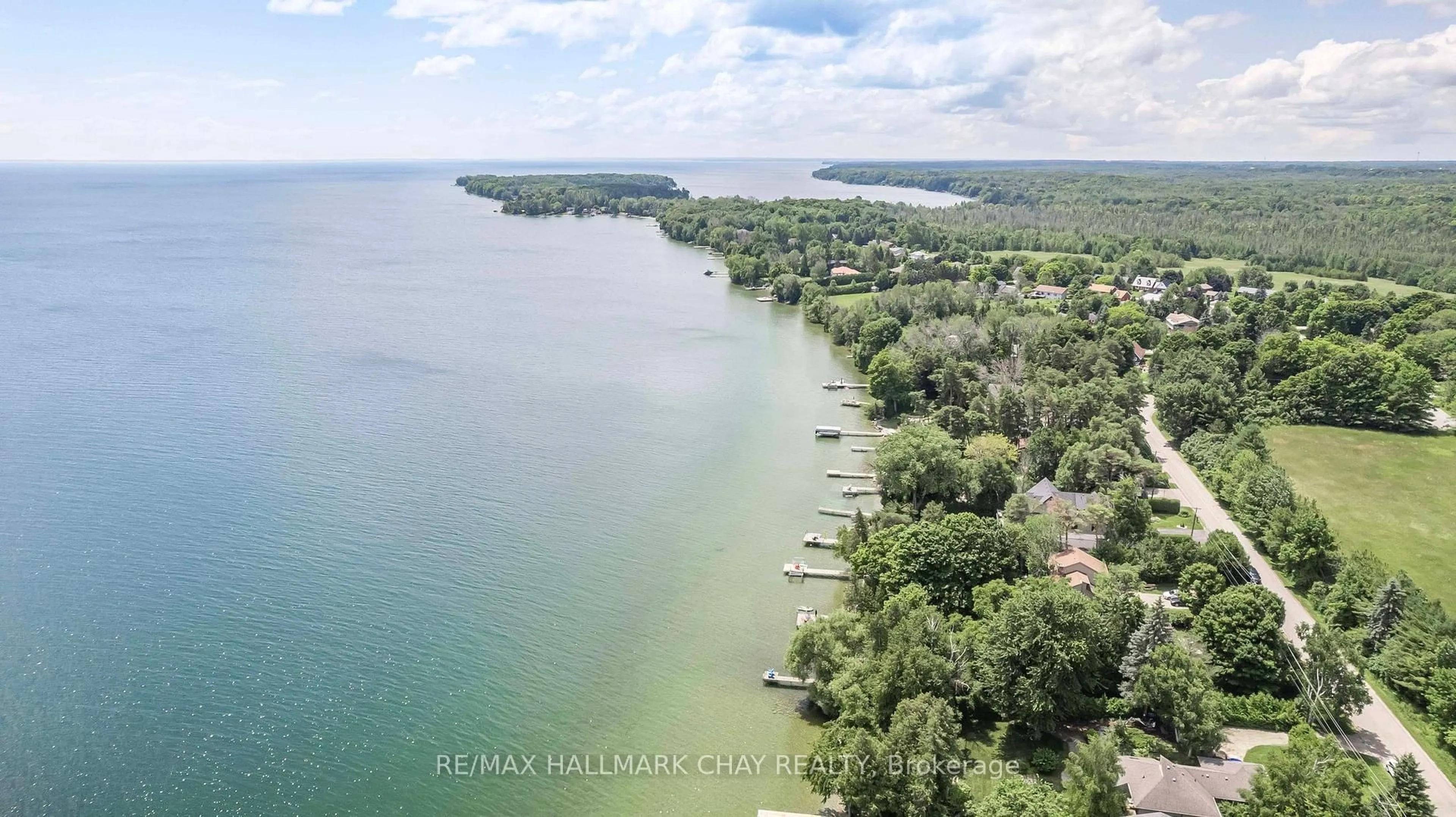 A pic from outside/outdoor area/front of a property/back of a property/a pic from drone, water/lake/river/ocean view for 1125 Woodland Dr, Oro-Medonte Ontario L3V 6H1