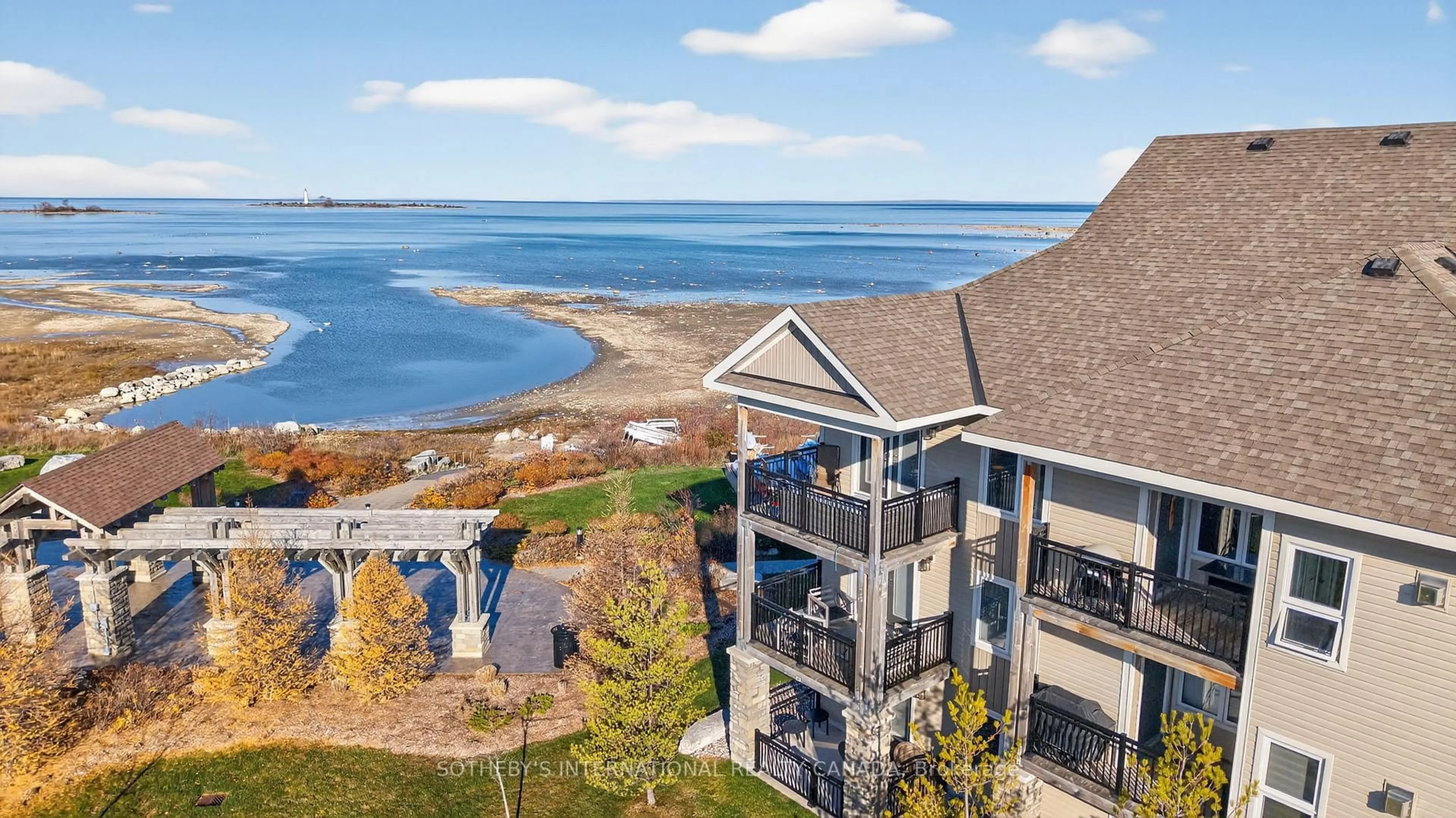 A pic from outside/outdoor area/front of a property/back of a property/a pic from drone, water/lake/river/ocean view for 4 Cove Crt #307, Collingwood Ontario L9Y 0Y6