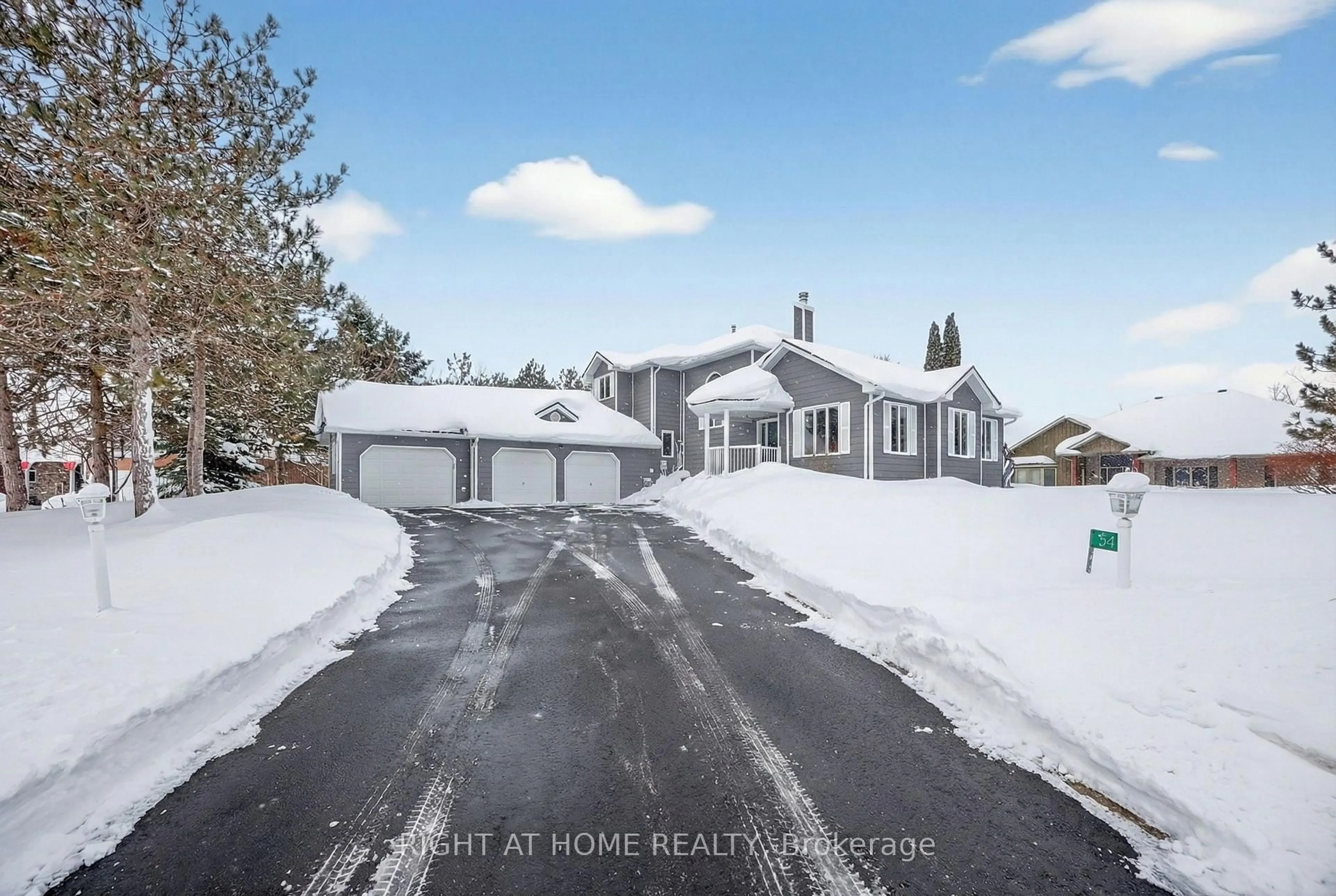 A pic from outside/outdoor area/front of a property/back of a property/a pic from drone, street for 54 Highland Dr, Oro-Medonte Ontario L0L 2L0