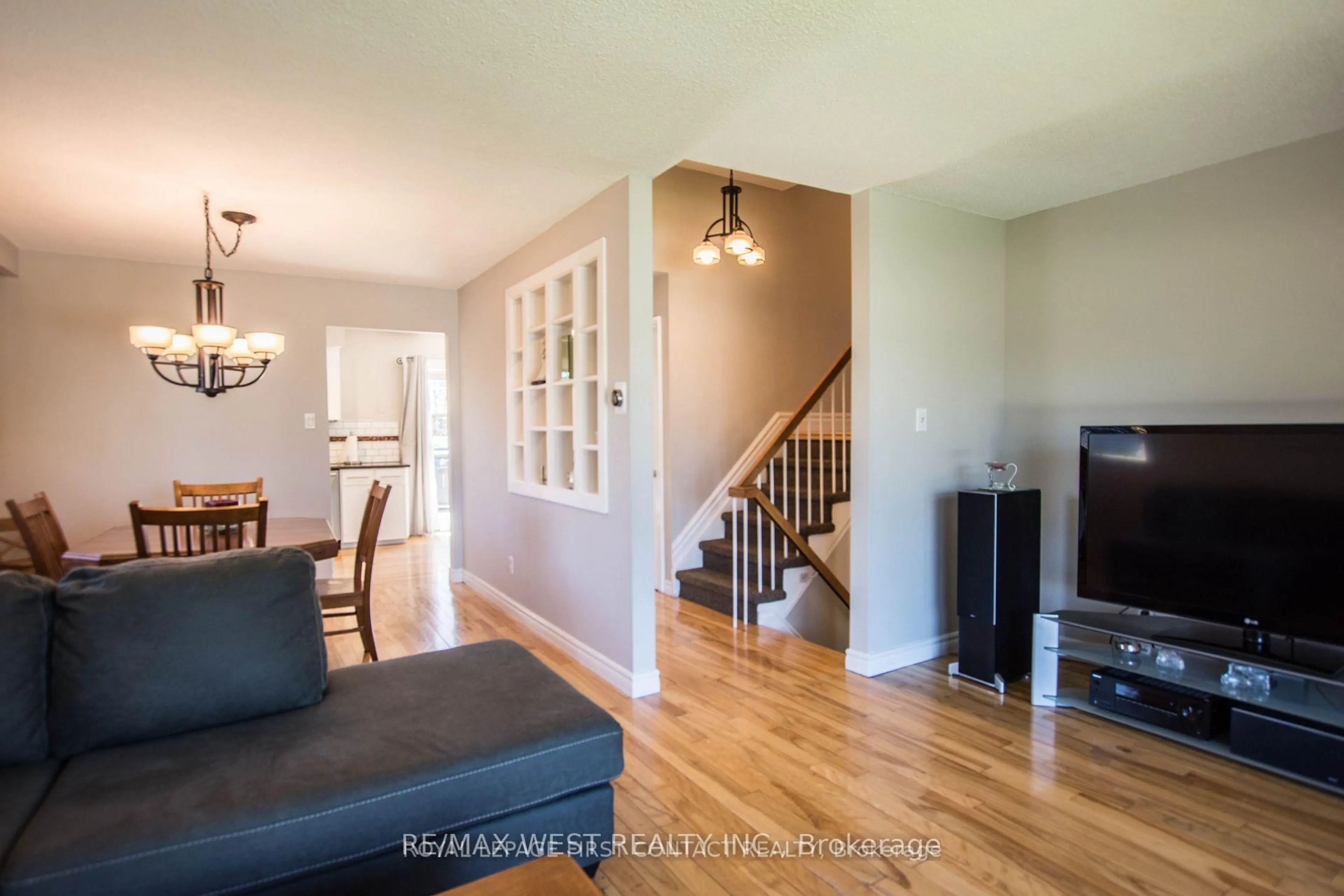 Living room with furniture, wood/laminate floor for 43 Clover Ave, Barrie Ontario L4N 5E2