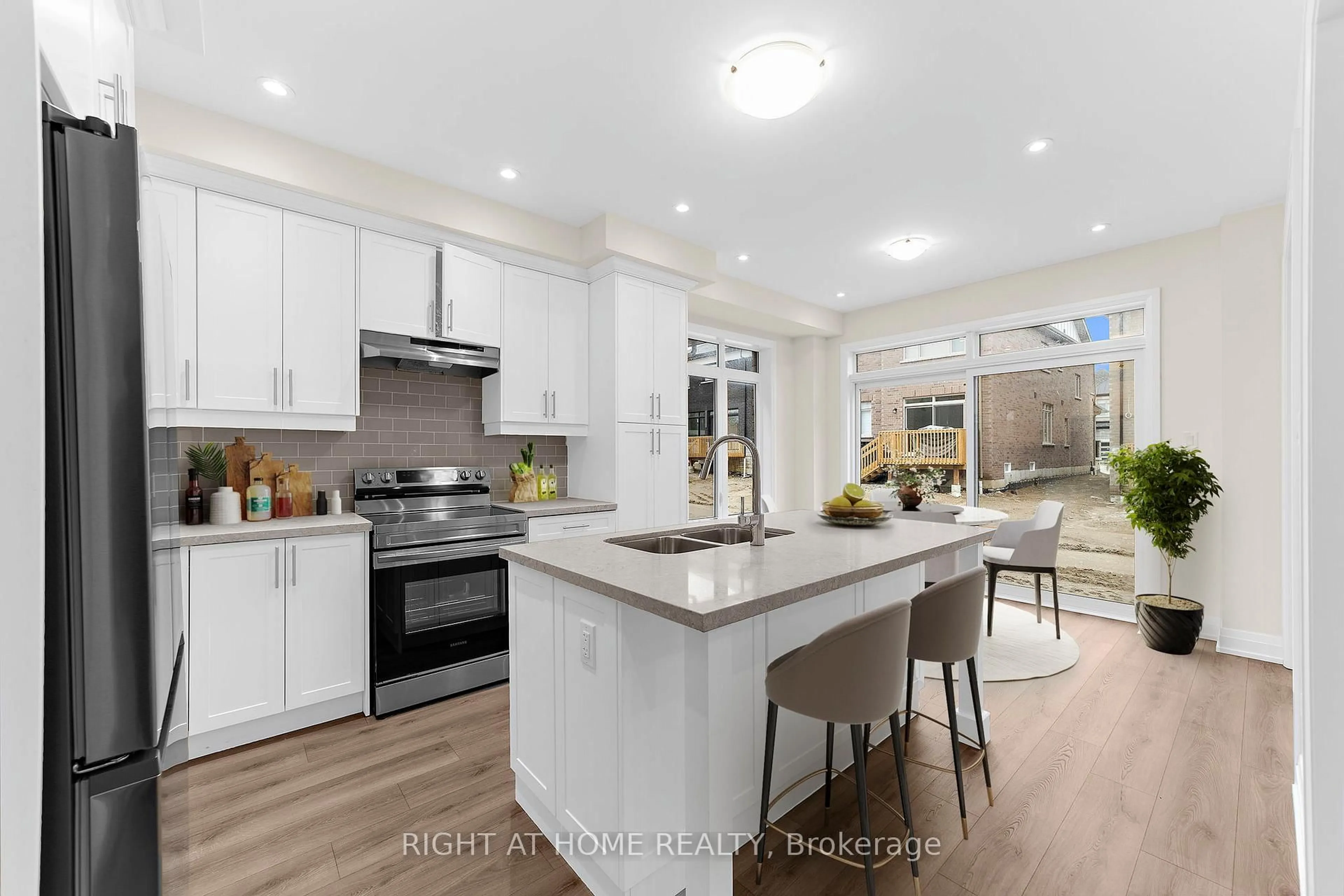 Open concept kitchen, unknown for 33 Calypso Ave, Springwater Ontario L9X 2E3