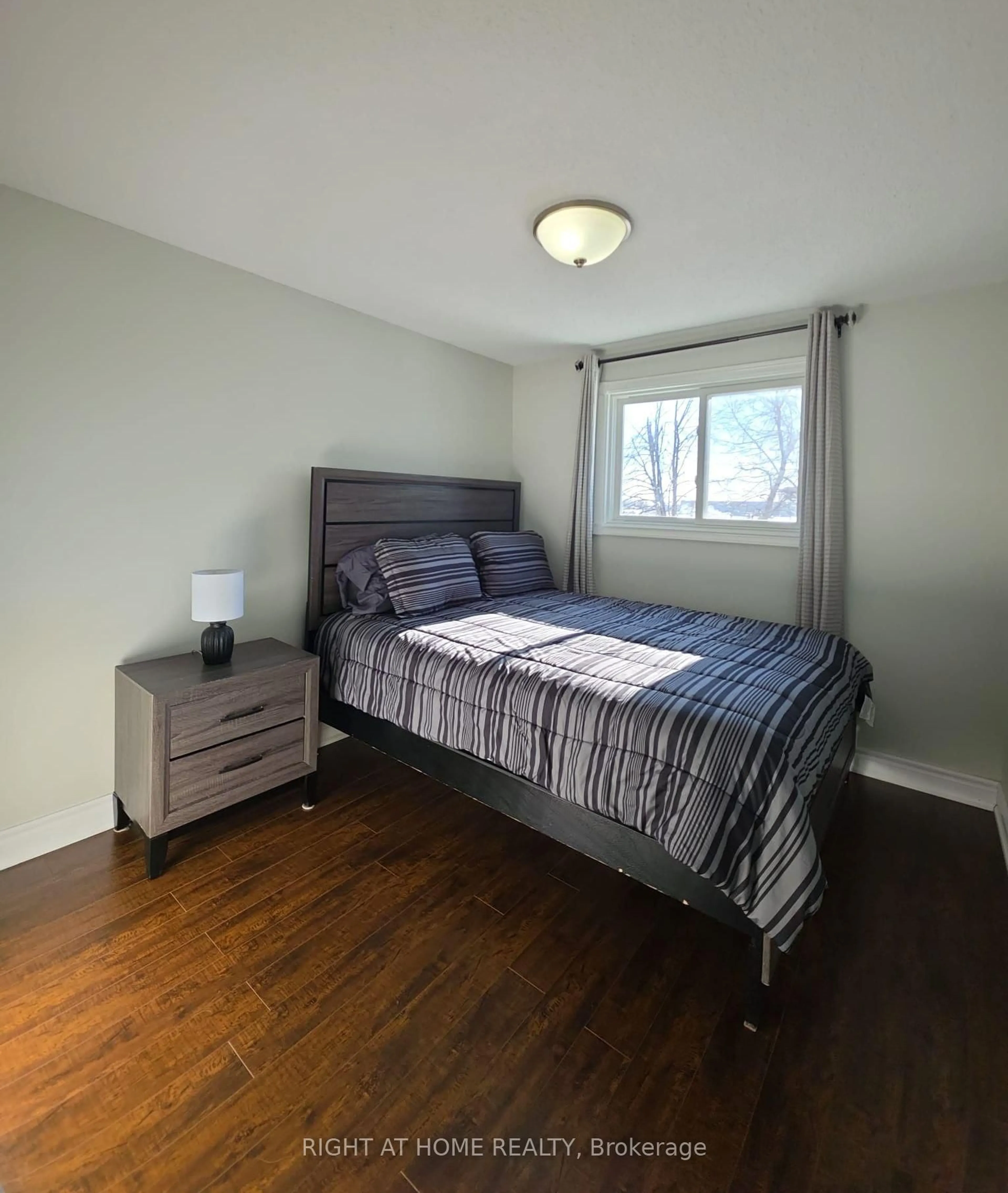 Bedroom with bed, wood/laminate floor for 15 Argyle Rd, Barrie Ontario L4N 6P9
