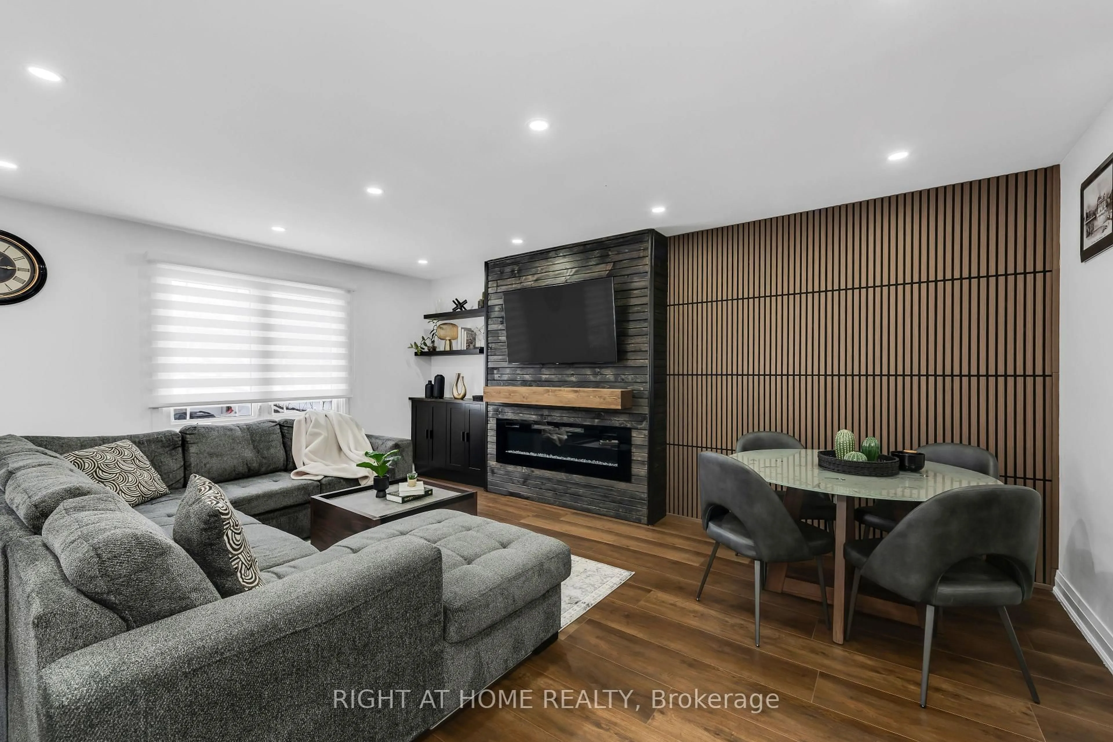 Living room with furniture, wood/laminate floor for 5 Carol Rd, Barrie Ontario L4N 3P6