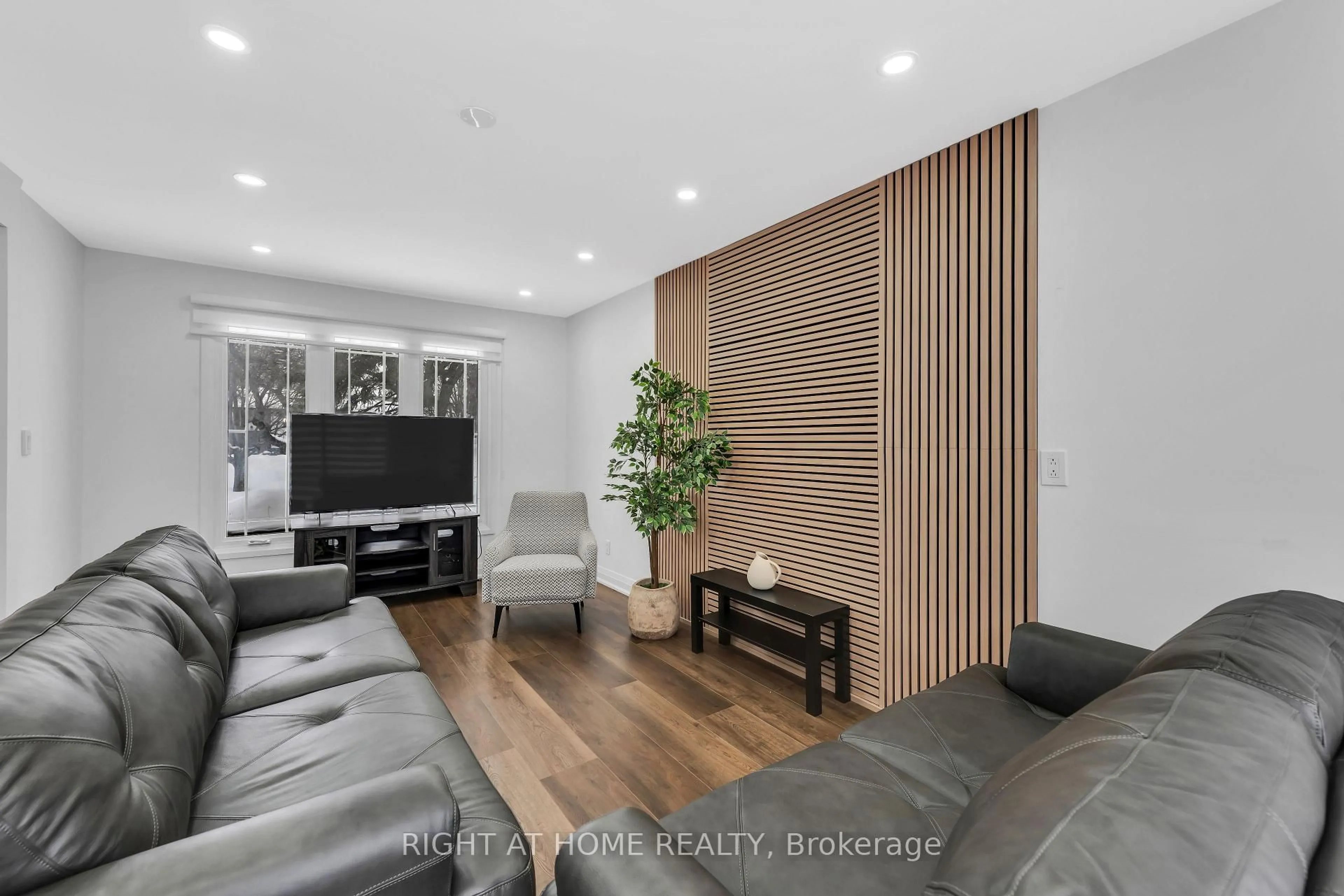 Living room with furniture, wood/laminate floor for 5 Carol Rd, Barrie Ontario L4N 3P6