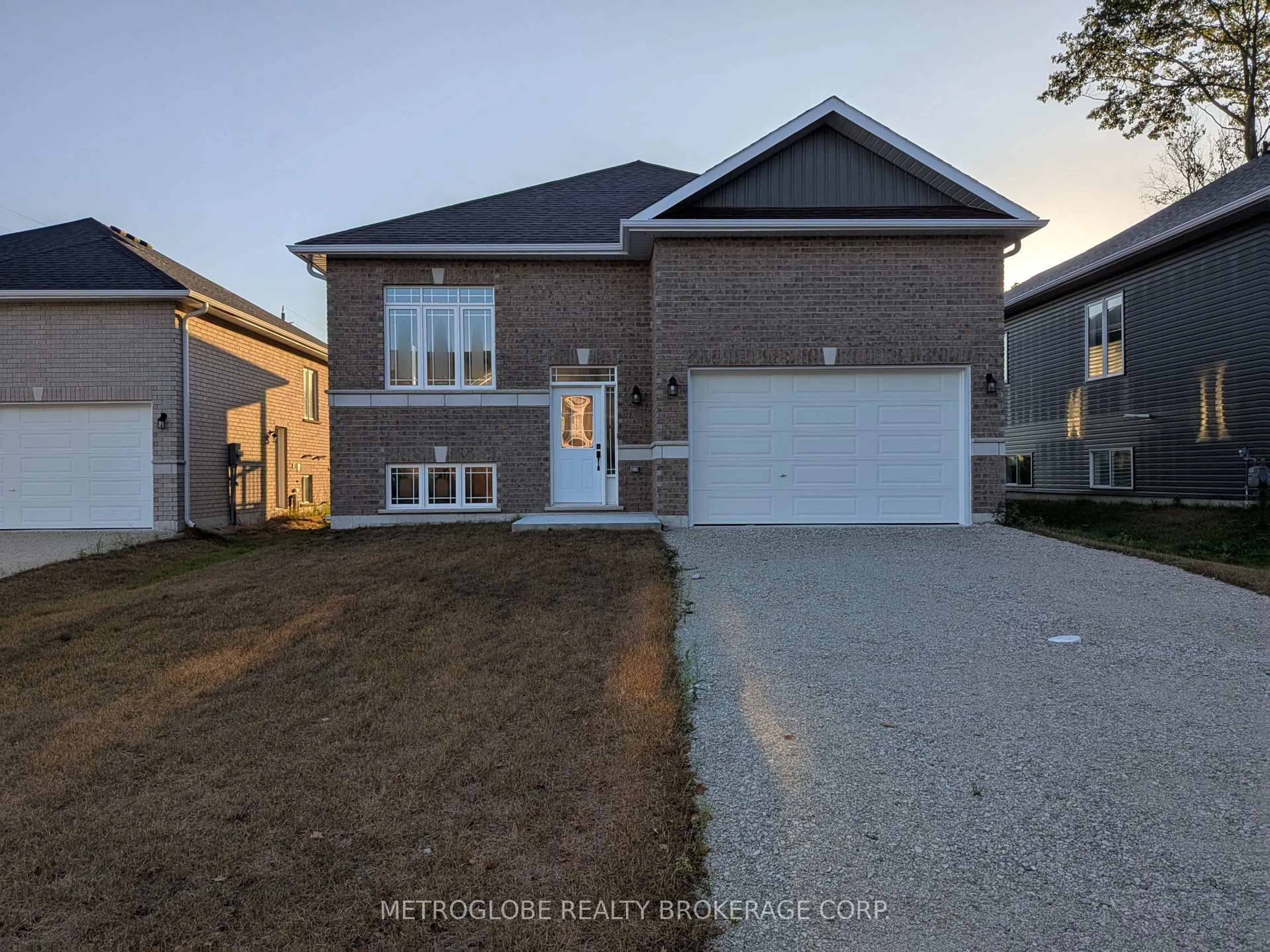 Home with brick exterior material, street for 4 JOANNE Cres, Wasaga Beach Ontario L9Z 0S2
