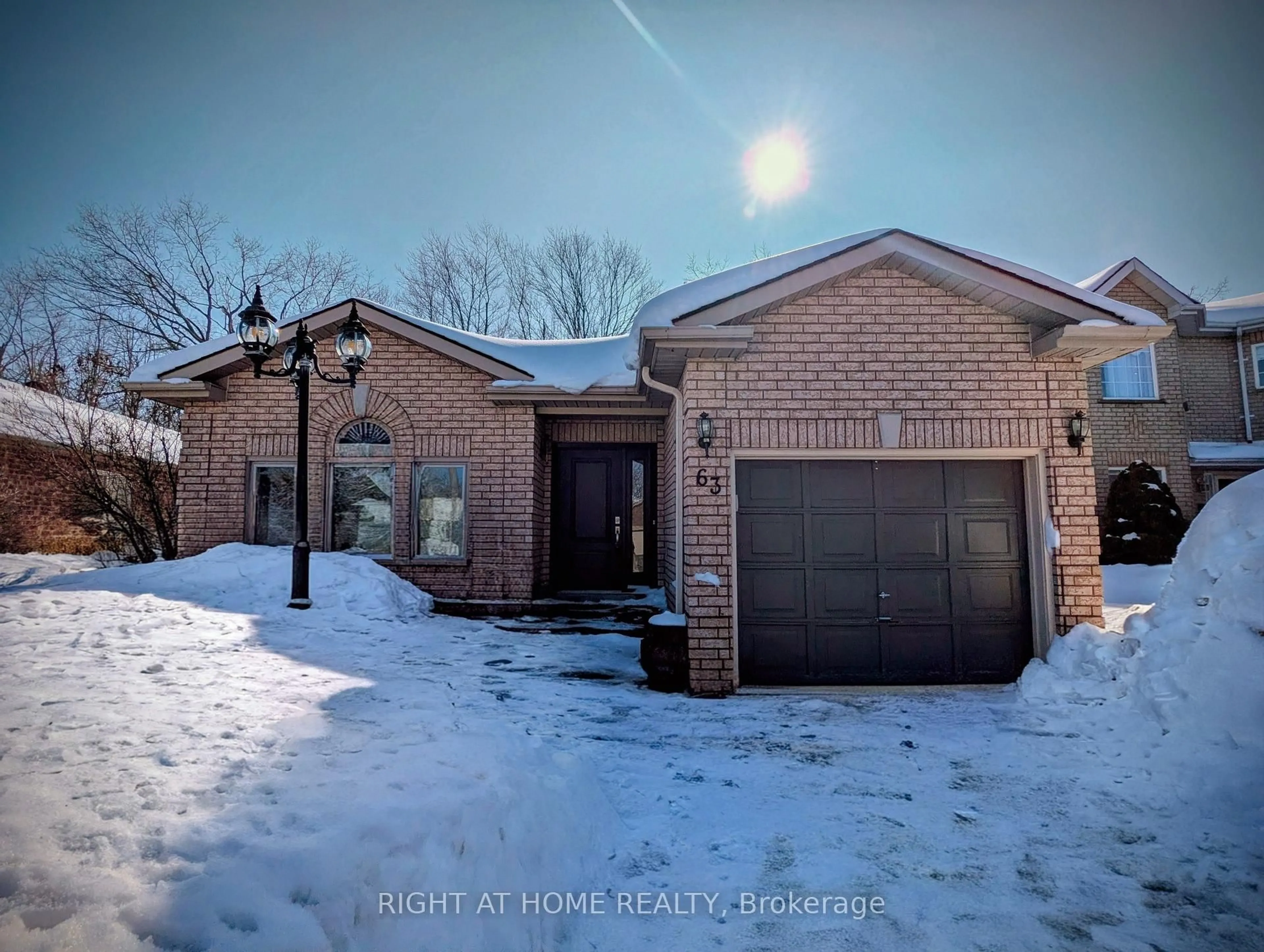 Home with brick exterior material, street for 63 Benson Dr, Barrie Ontario L4N 7Y2