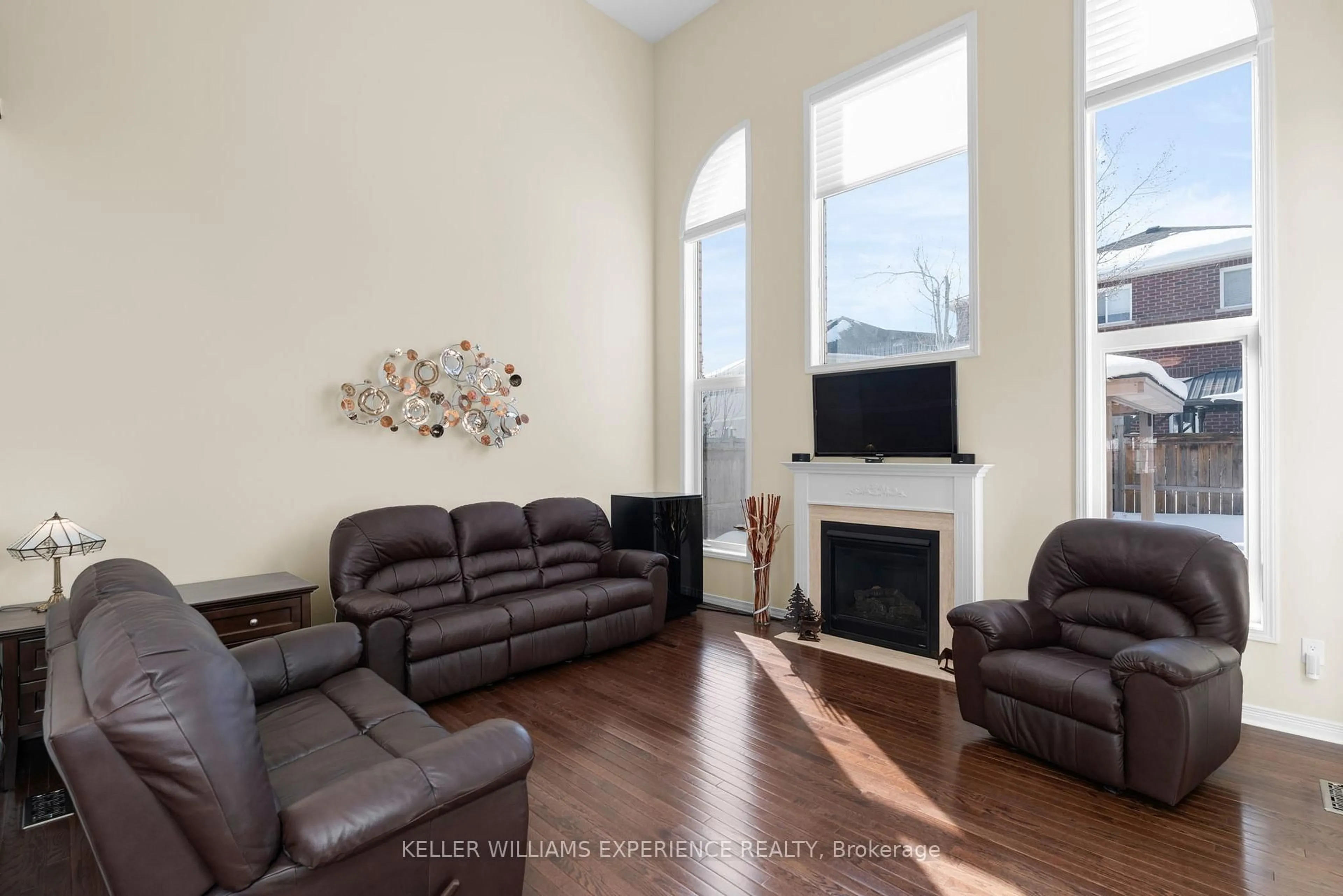 Living room with furniture, wood/laminate floor for 14 Charlemagne Ave, Barrie Ontario L4M 0A9