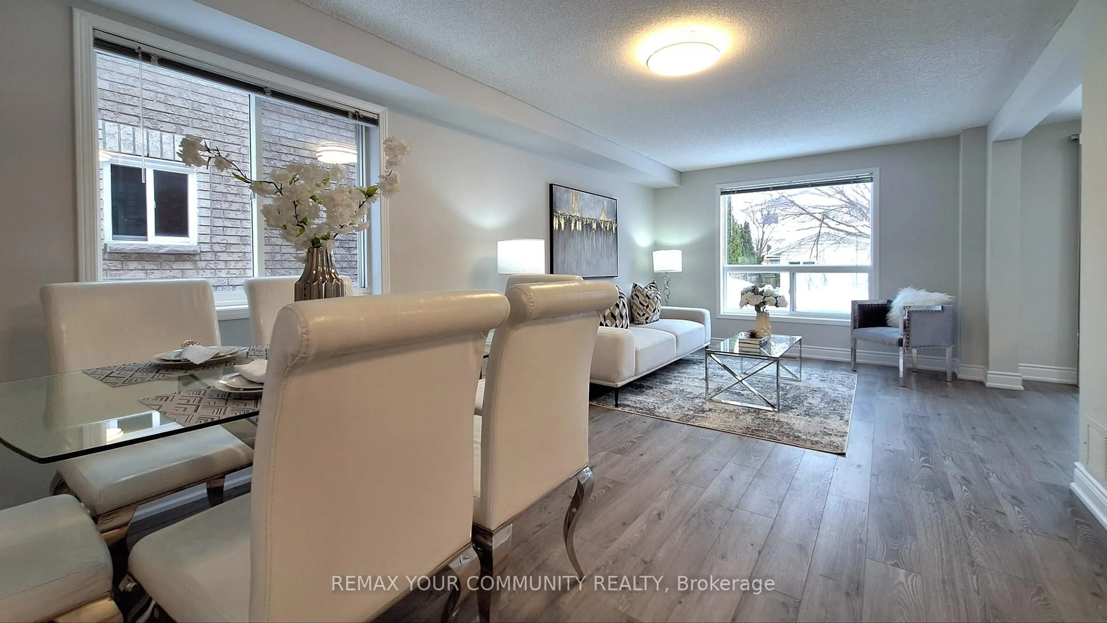 Living room with furniture, wood/laminate floor for 8 Srigley St, Barrie Ontario L4N 0L9