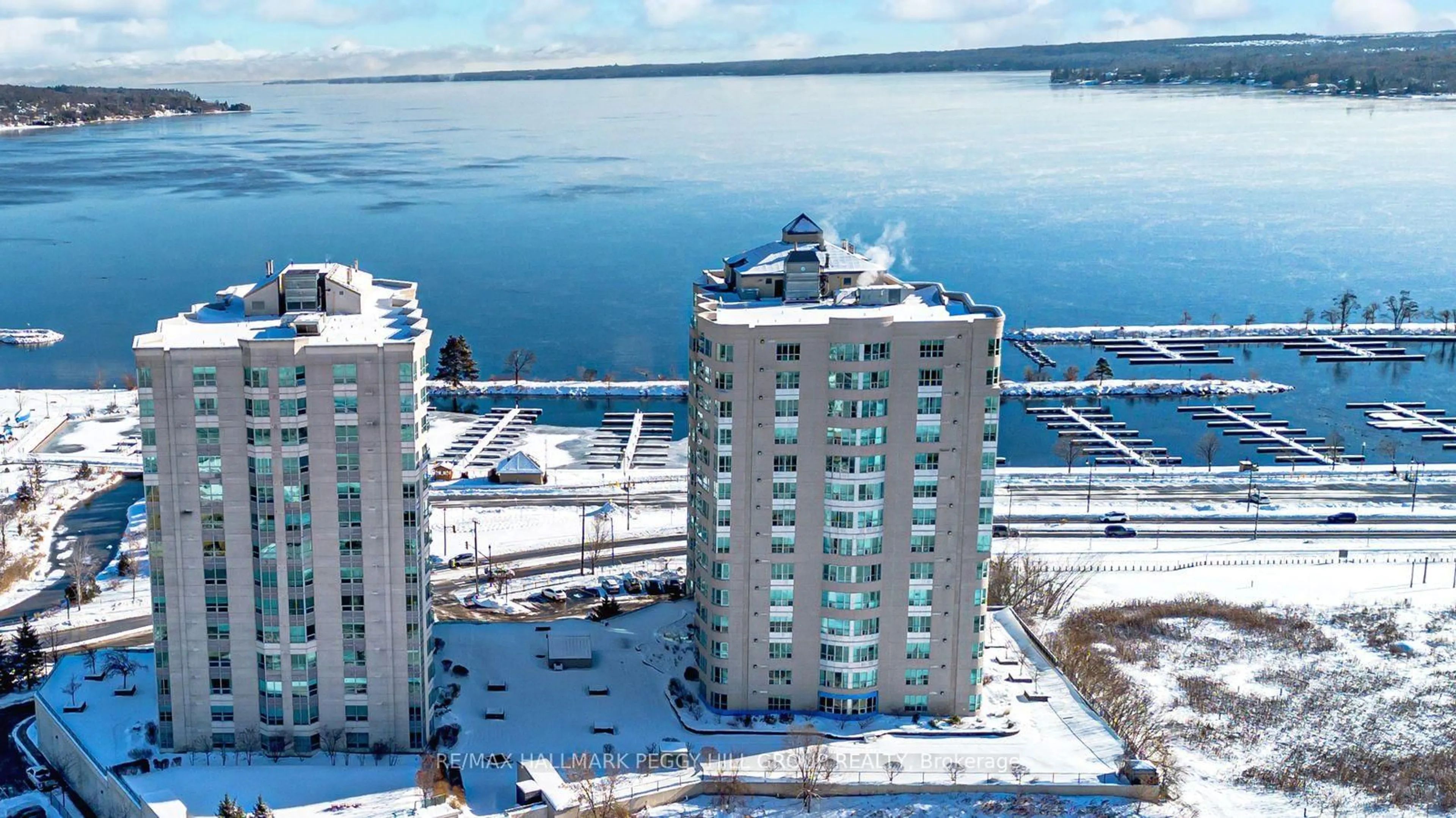 A pic from outside/outdoor area/front of a property/back of a property/a pic from drone, water/lake/river/ocean view for 2 Toronto St #PH2/3, Barrie Ontario L4N 9R2