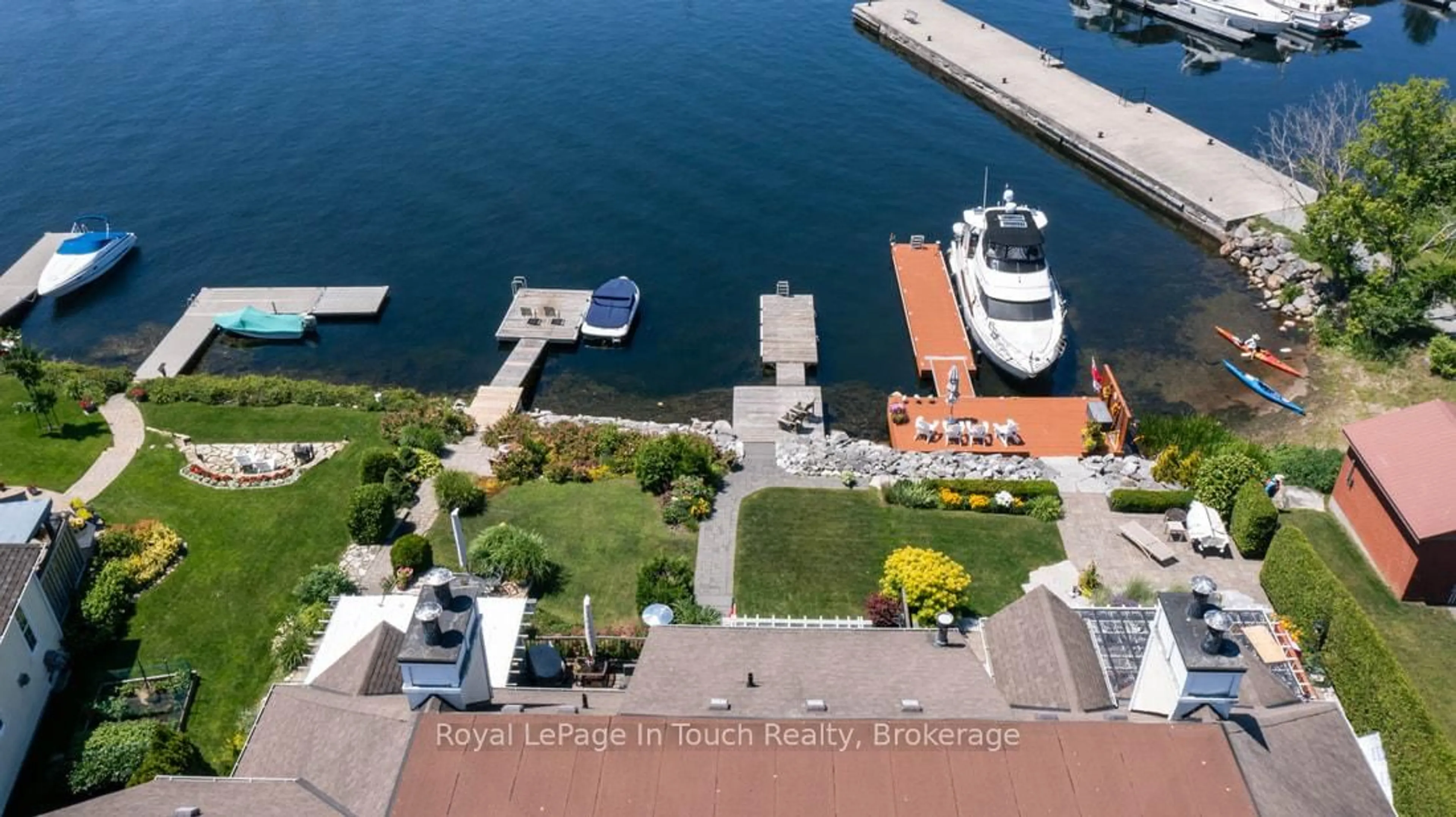 A pic from outside/outdoor area/front of a property/back of a property/a pic from drone, water/lake/river/ocean view for 102 Wycliffe Cove, Tay Ontario L0K 2A0