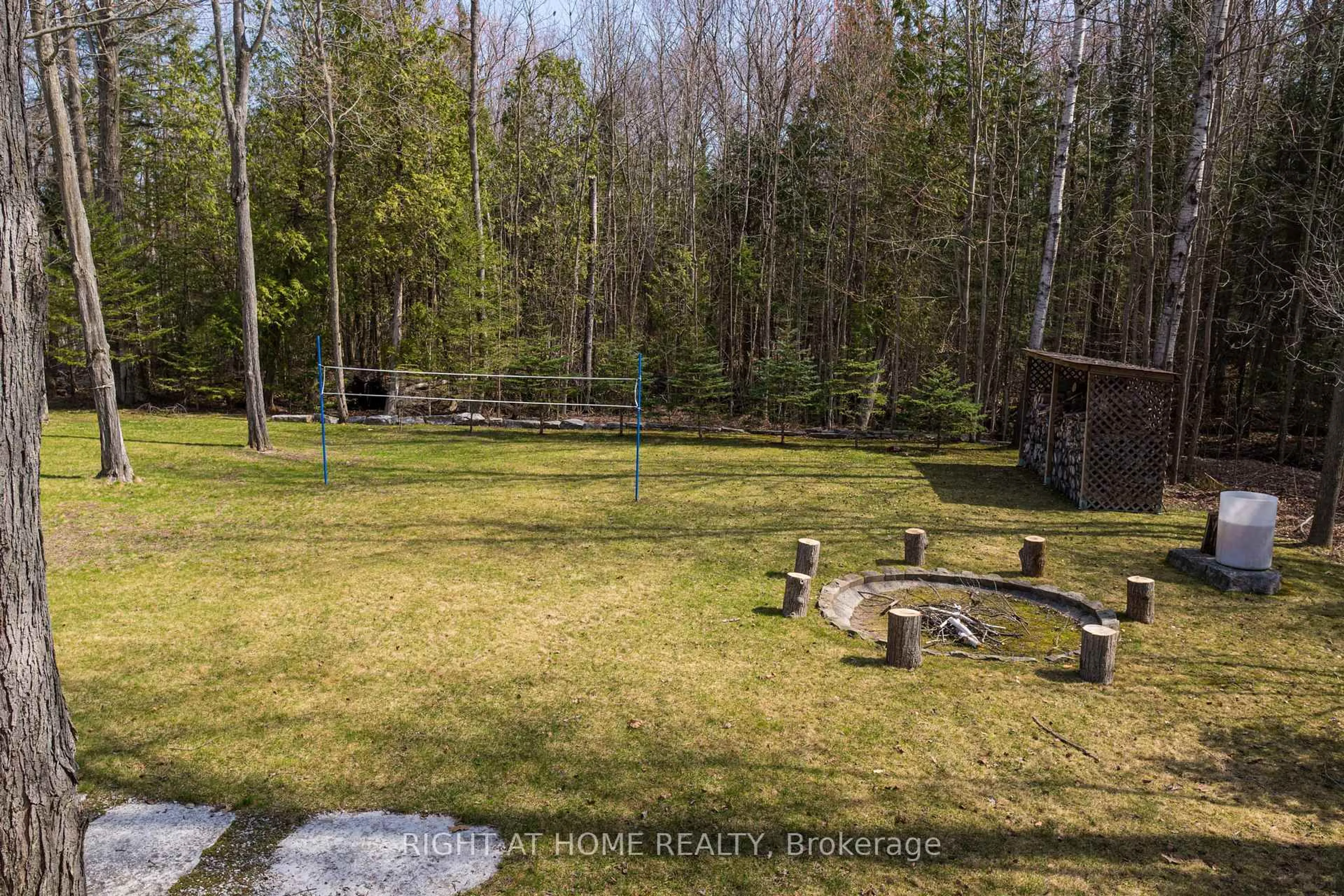 A pic from outside/outdoor area/front of a property/back of a property/a pic from drone, forest/trees view for 57 Old Trail Rd, Tiny Ontario L0L 2T0