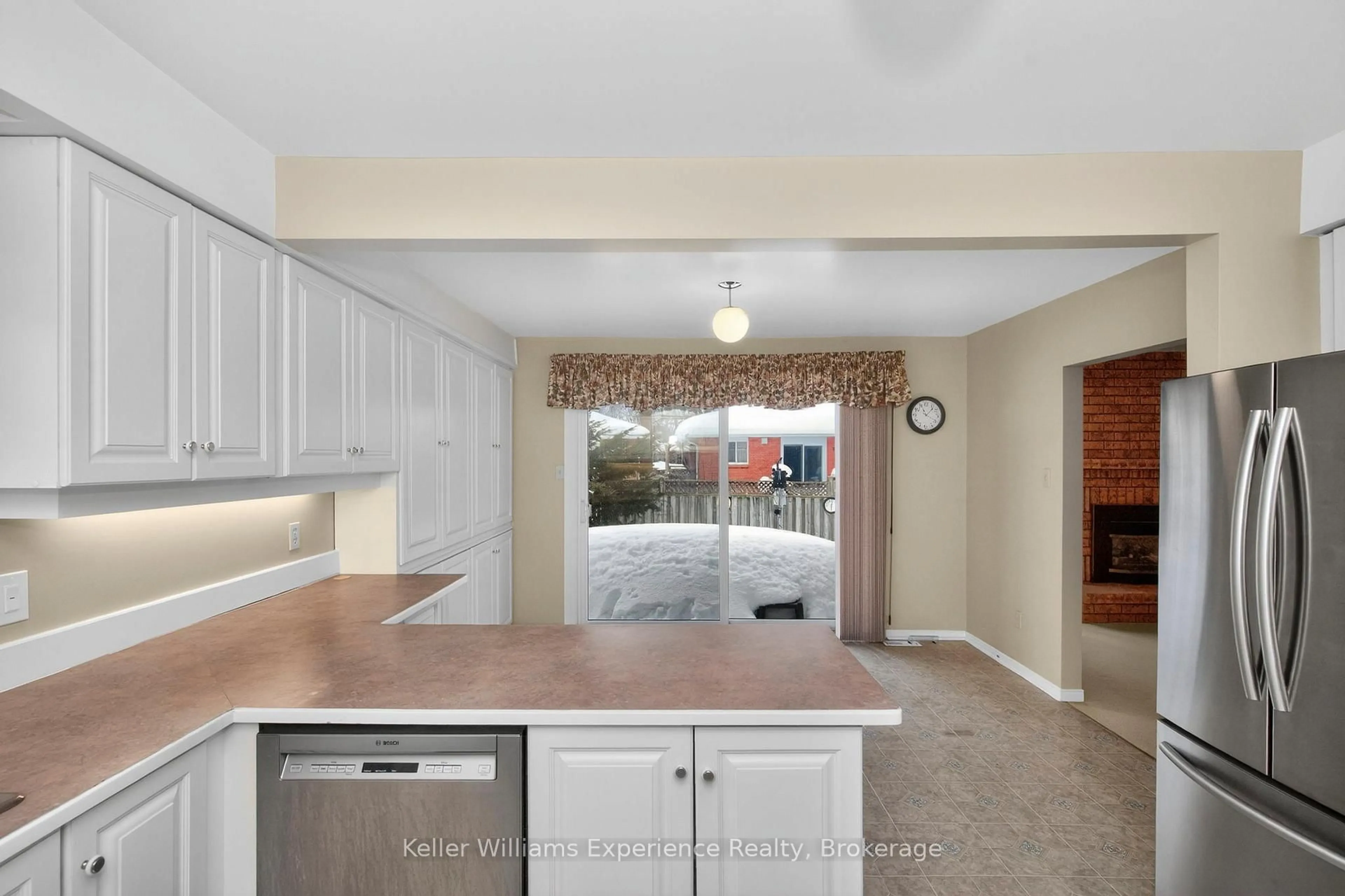 Open concept kitchen, ceramic/tile floor for 943 Playfair Rd, Midland Ontario L4R 4X9