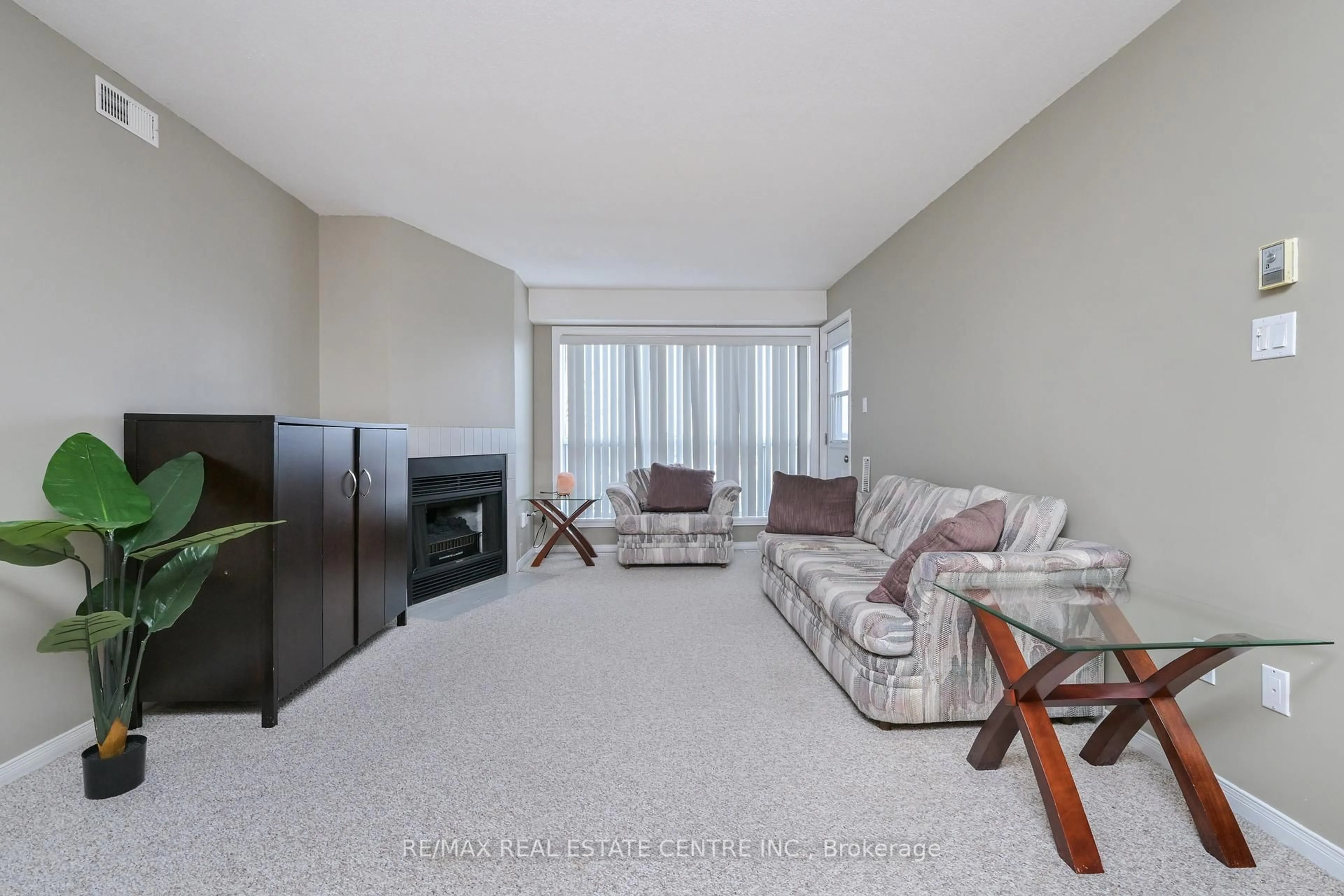 Living room with furniture, unknown for 120 Bell Farm Rd #409, Barrie Ontario L4M 6J2