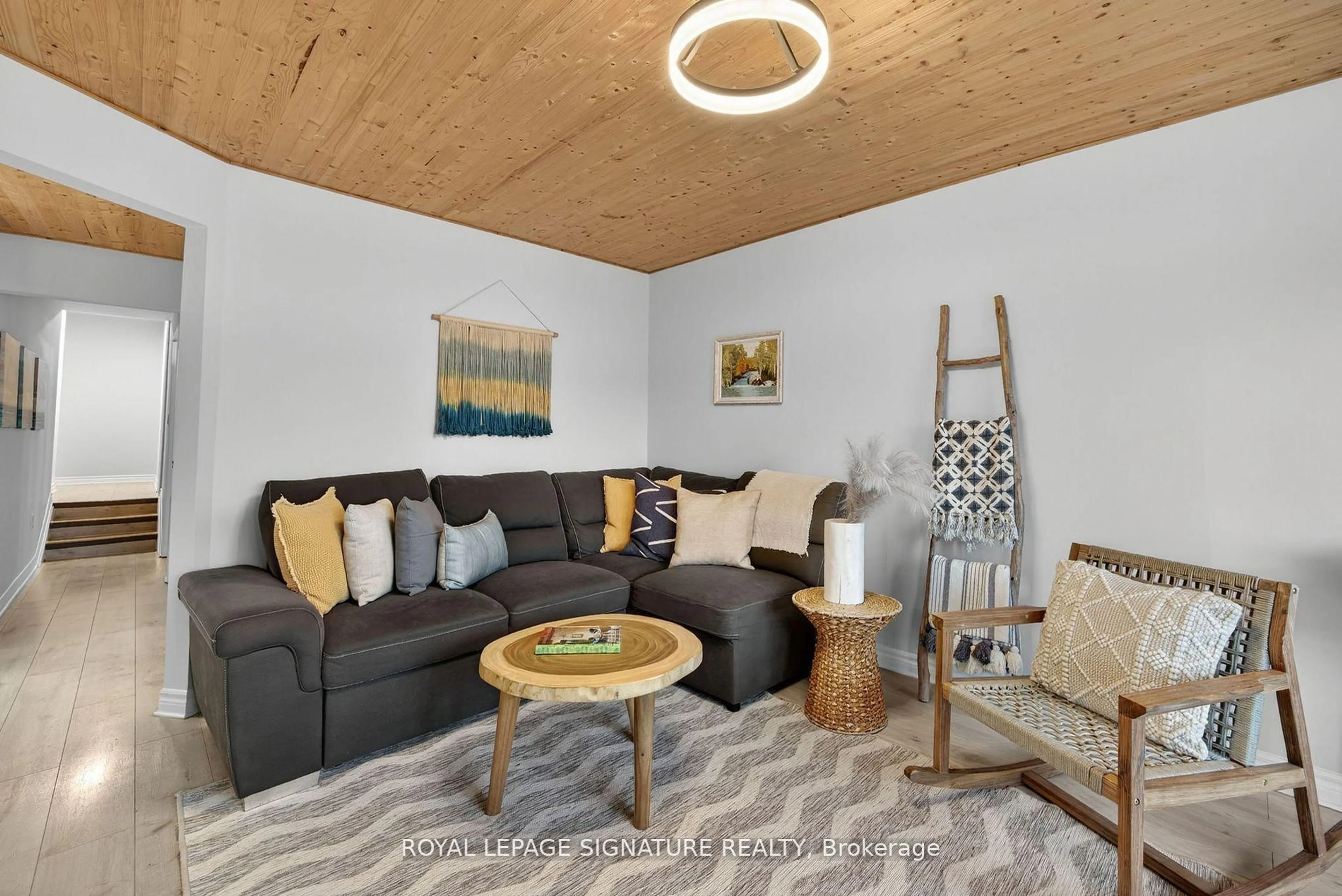 Living room with furniture, wood/laminate floor for 57 Maria St, Penetanguishene Ontario L9M 1L3