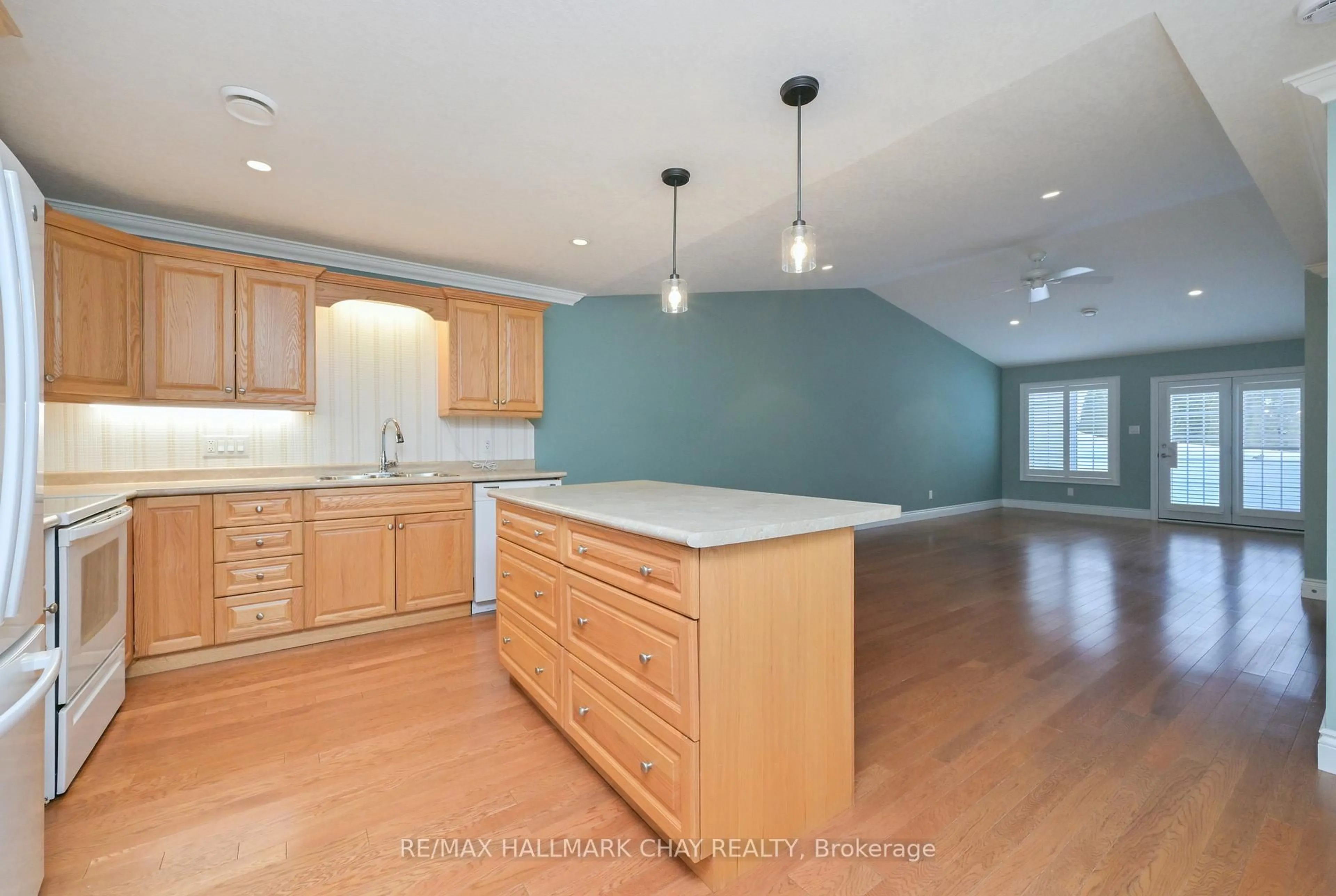 Open concept kitchen, wood/laminate floor for 140 Meadow Lane, Wasaga Beach Ontario L9Z 0A4