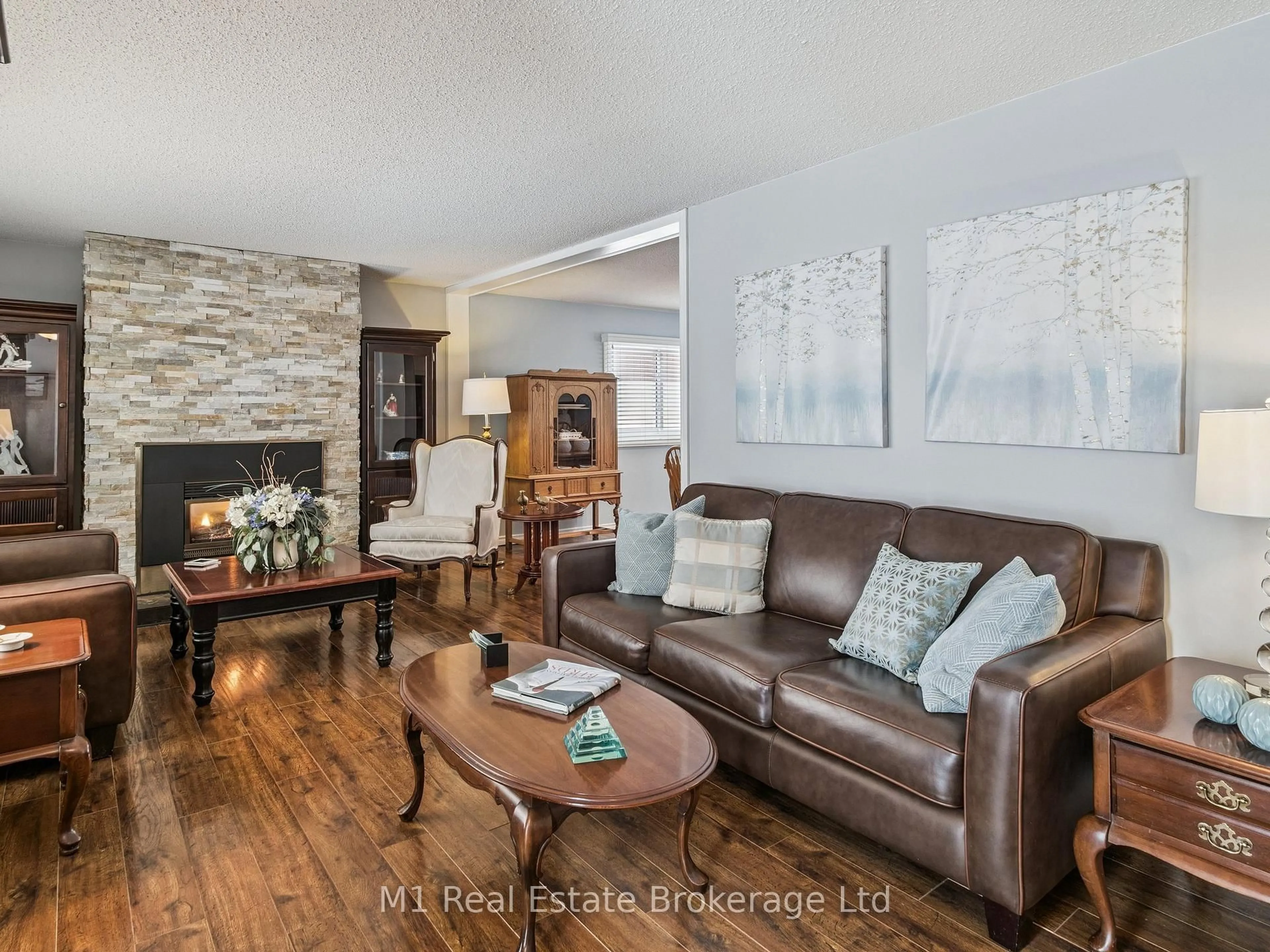 Living room with furniture, wood/laminate floor for 94 Tamarack Dr, Oro-Medonte Ontario L0L 1T0