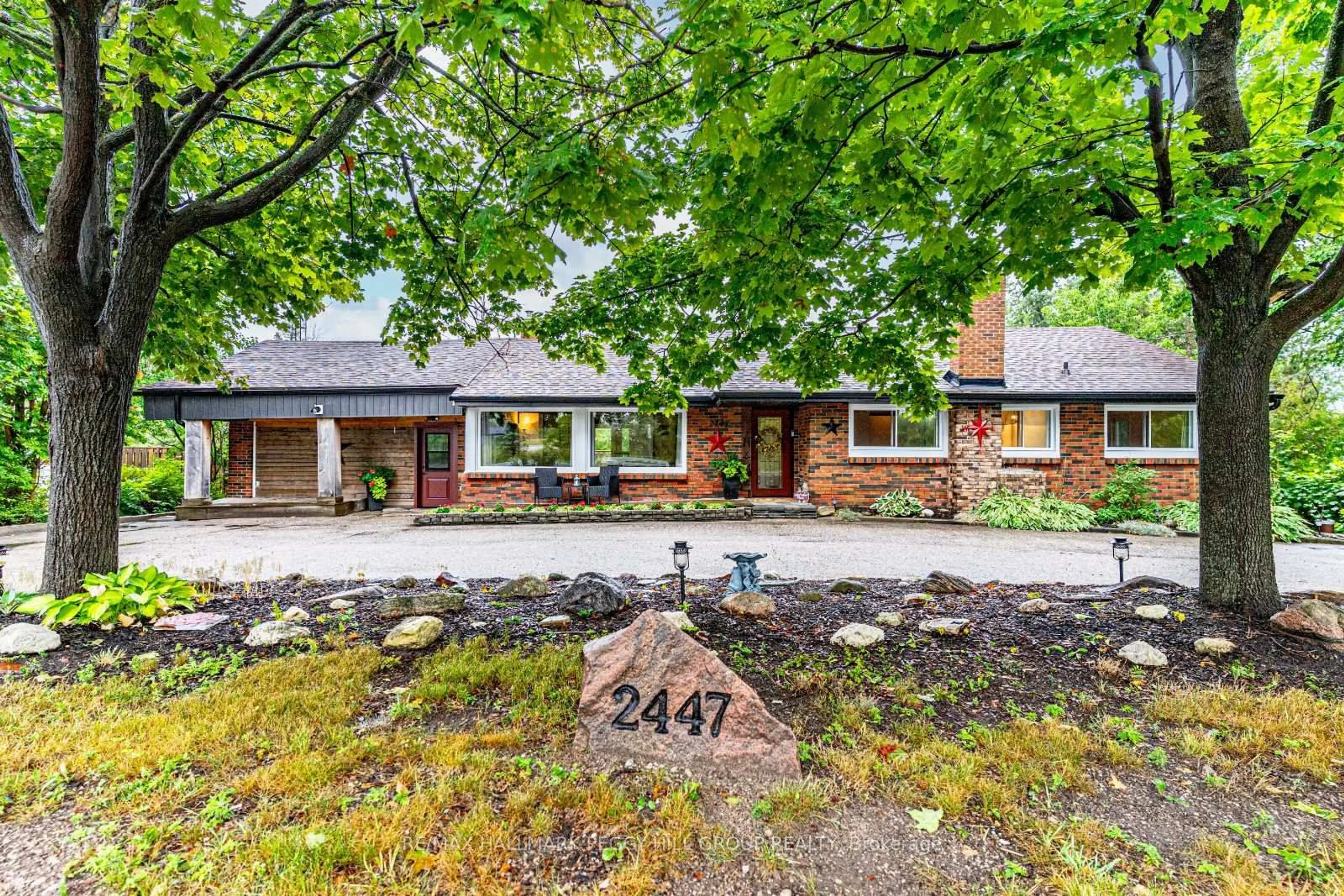 Home with brick exterior material, street for 2447 Ridge Rd, Oro-Medonte Ontario L0L 2L0