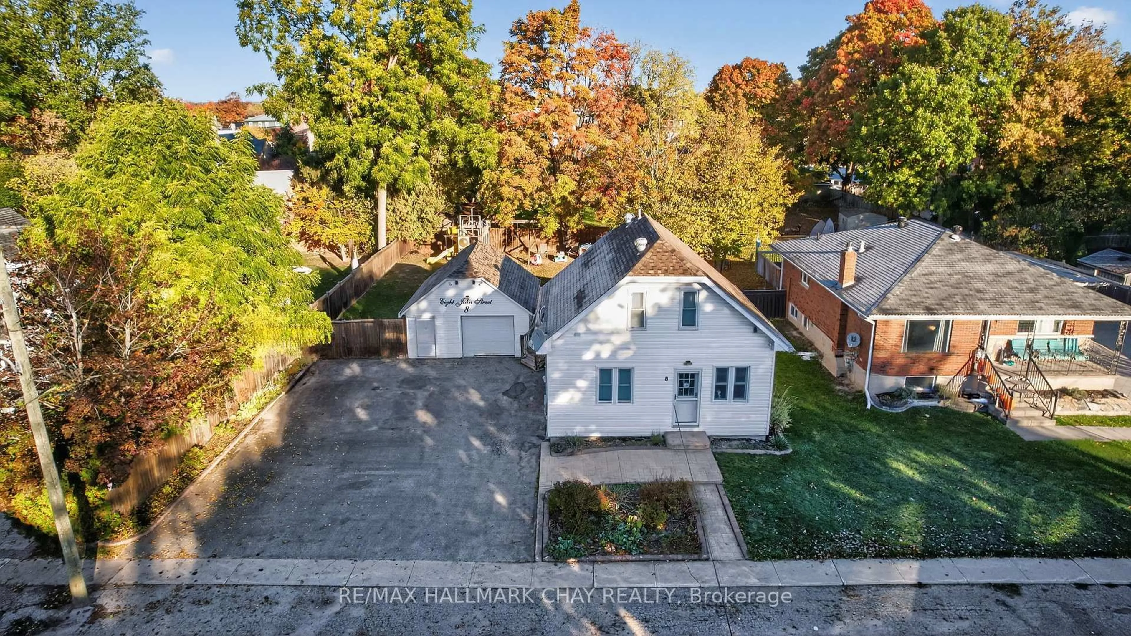 A pic from outside/outdoor area/front of a property/back of a property/a pic from drone, street for 8 John St, Springwater Ontario L0L 1P0