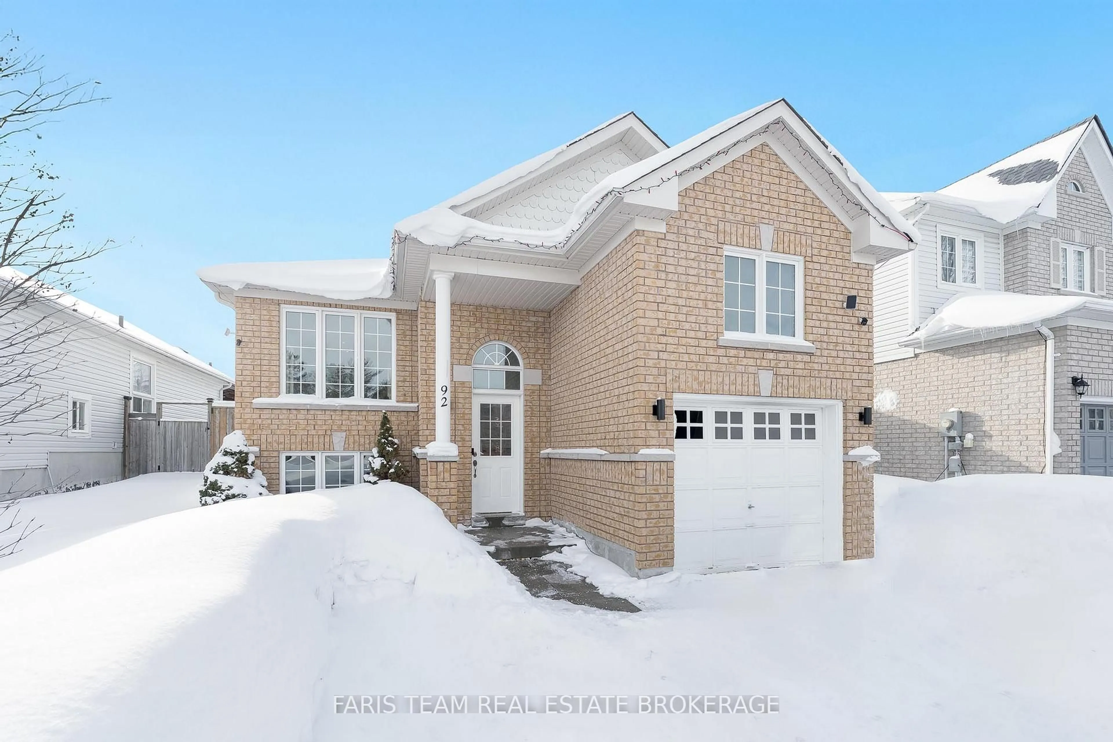 Home with brick exterior material, street for 92 Wesley Ave, Wasaga Beach Ontario L9Z 0B9