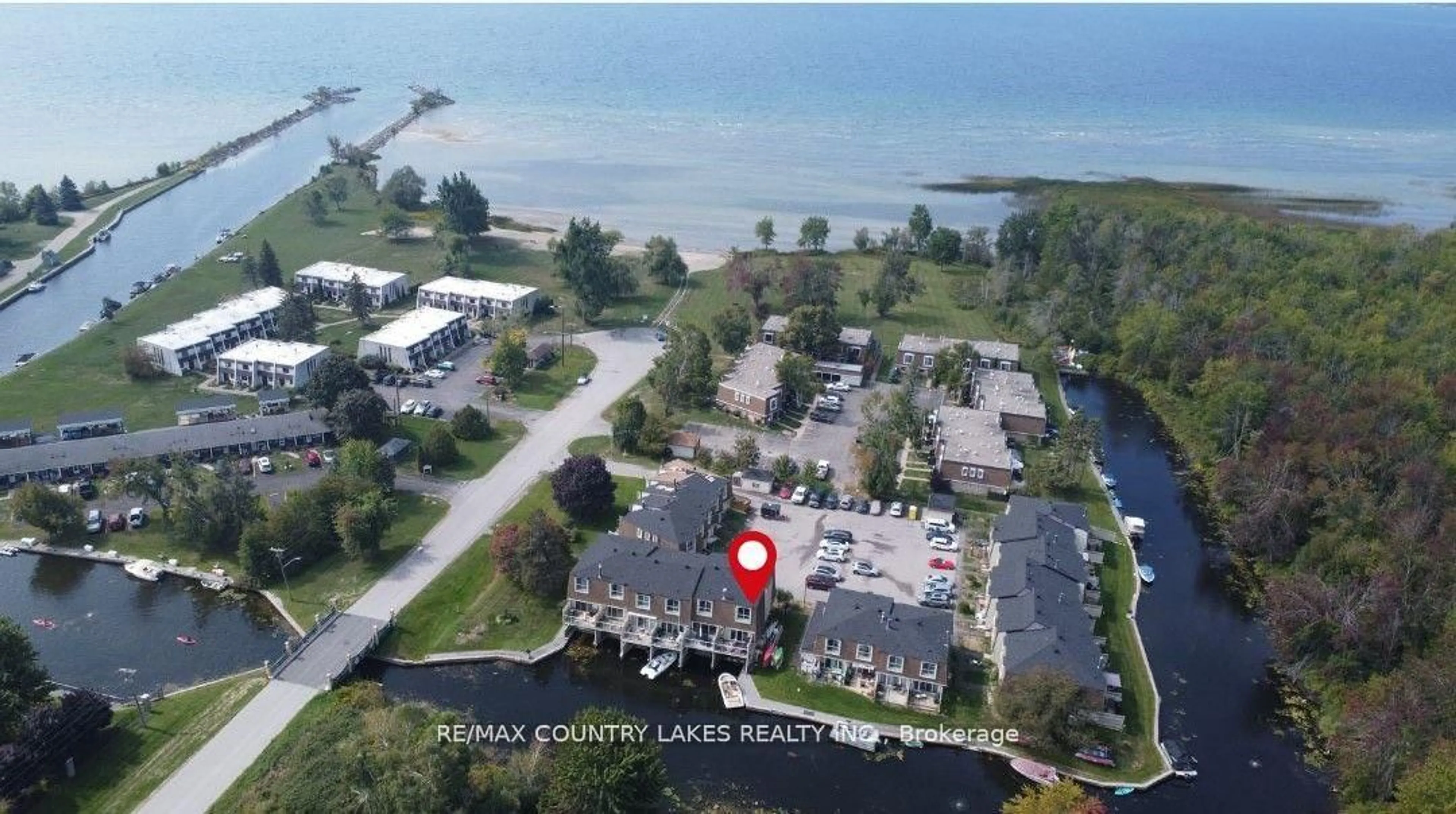 A pic from outside/outdoor area/front of a property/back of a property/a pic from drone, water/lake/river/ocean view for 4 Paradise Blvd #11, Ramara Ontario L0K 1B0