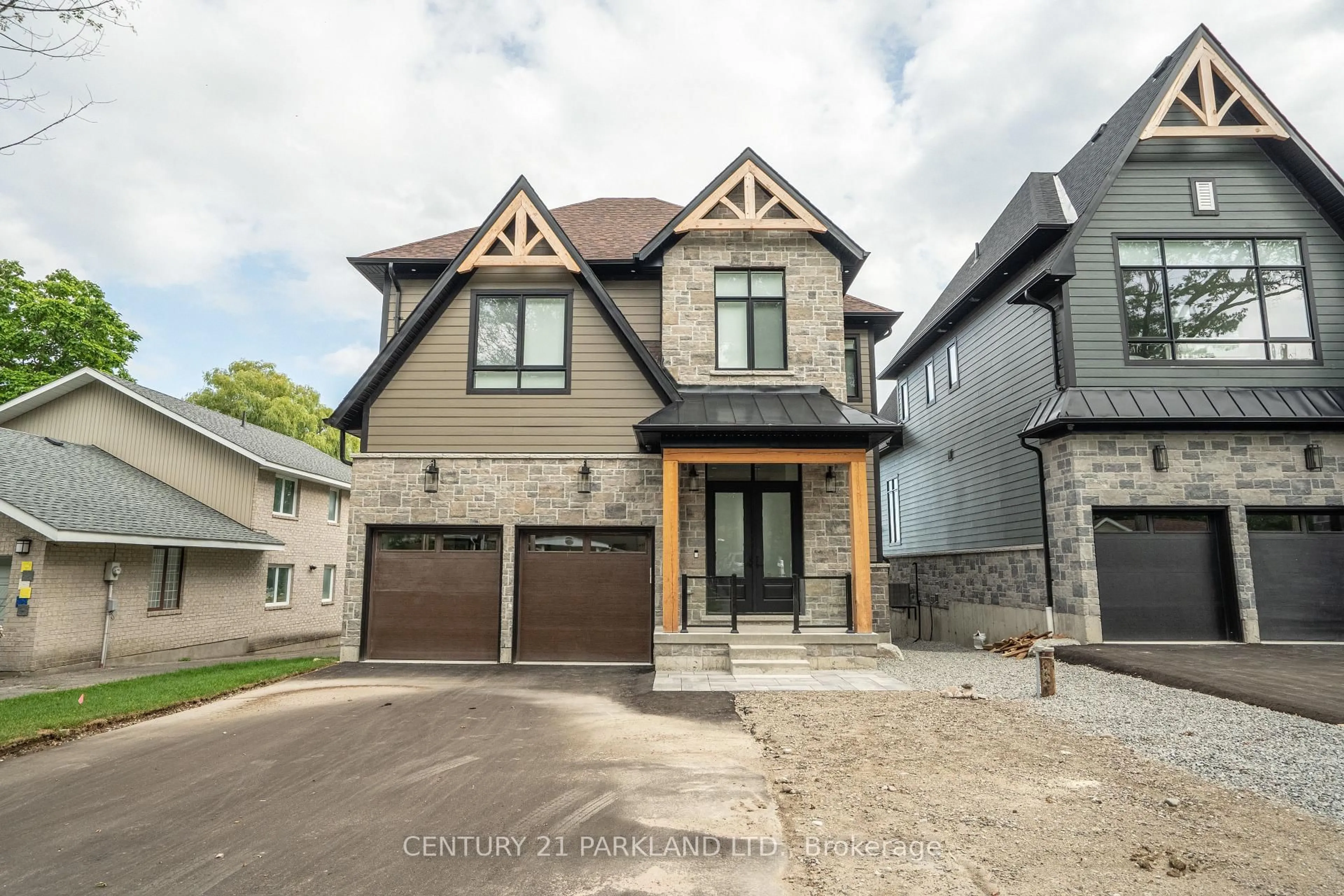 Home with brick exterior material, street for 326 Tiny Beaches Rd, Tiny Ontario L0L 2J0