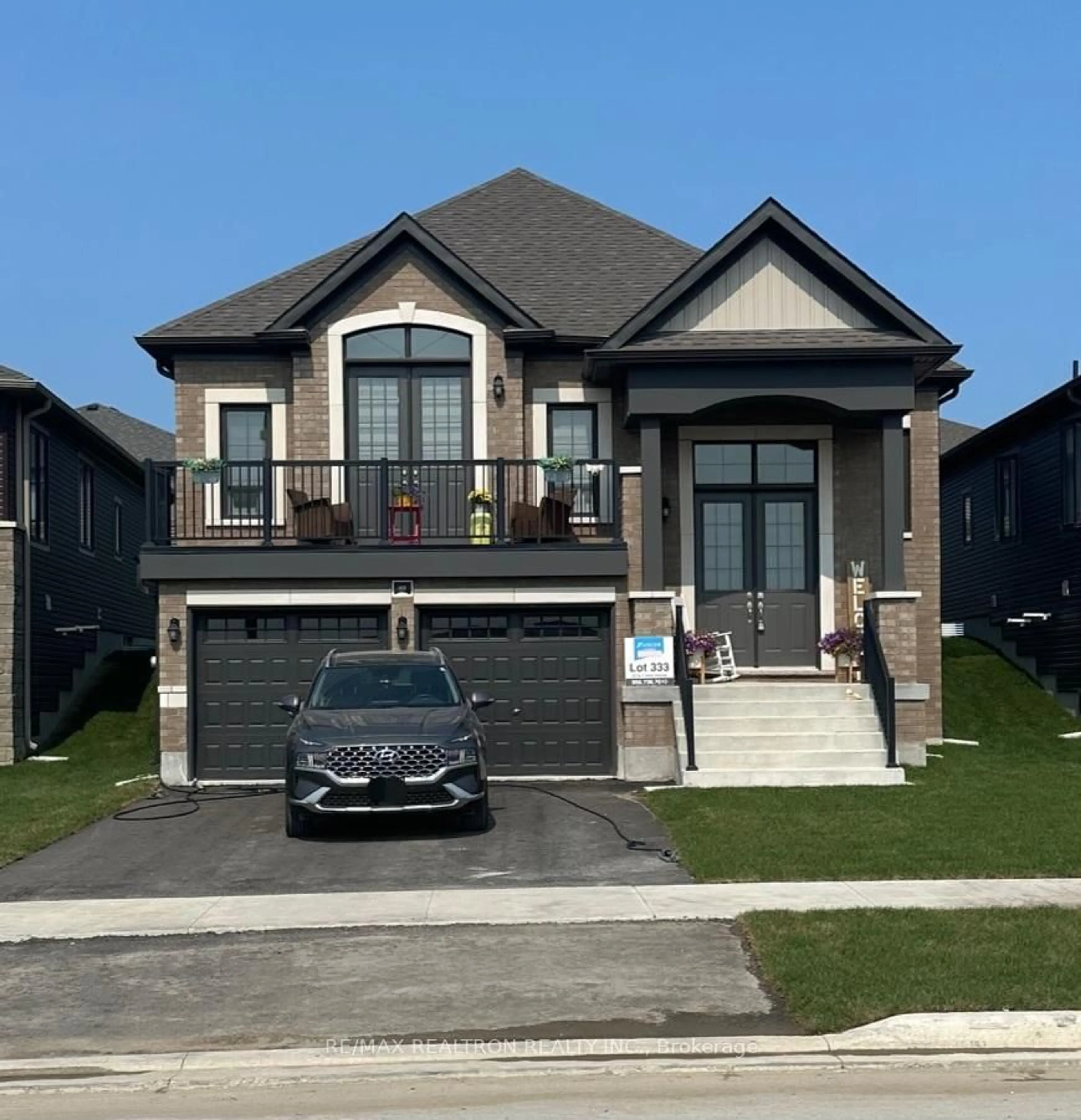 Home with brick exterior material, street for 69 Sun Valley Ave, Wasaga Beach Ontario L9Z 0N7