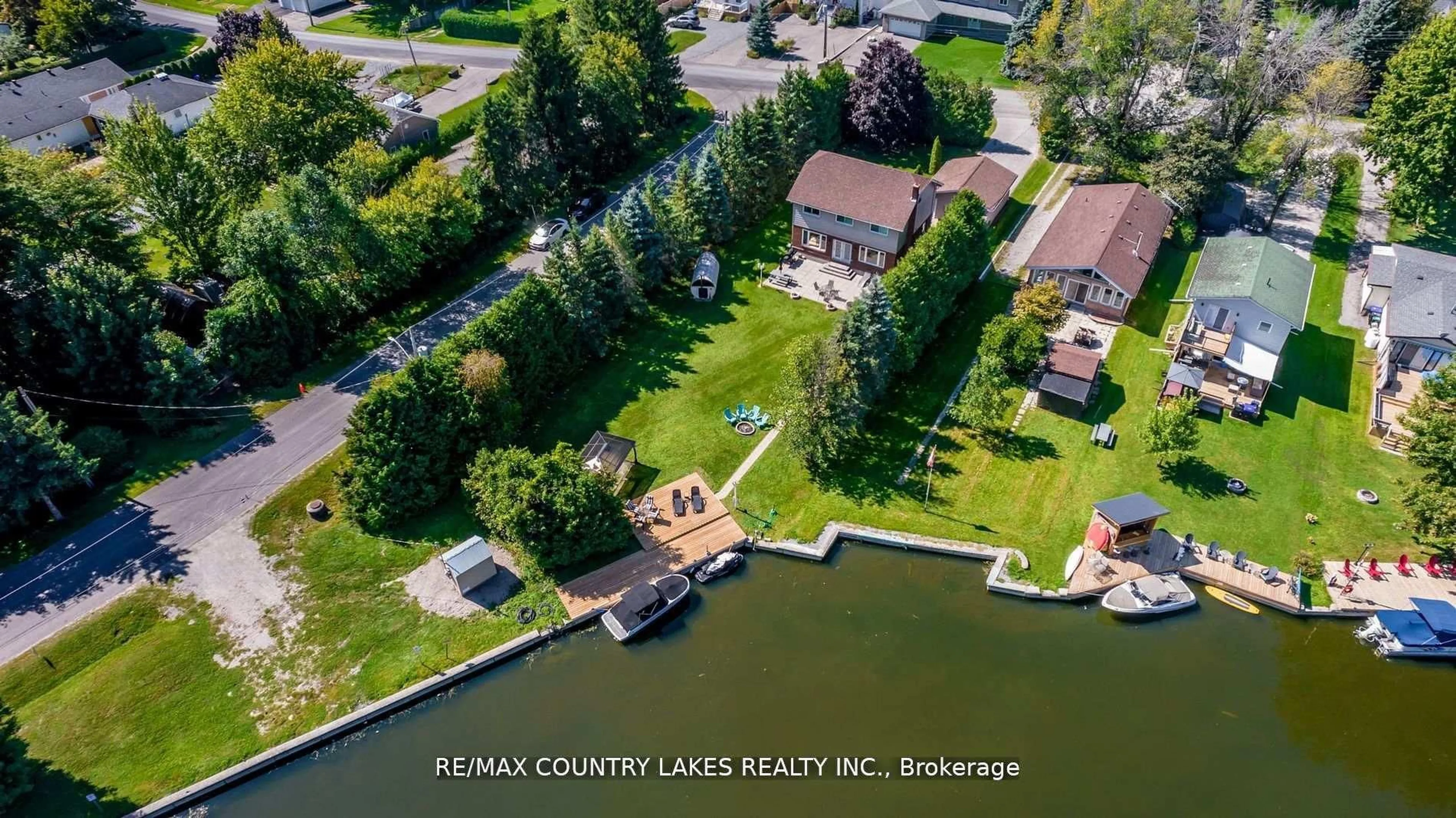 A pic from outside/outdoor area/front of a property/back of a property/a pic from drone, water/lake/river/ocean view for 47 Lake Ave, Ramara Ontario L0K 1B0