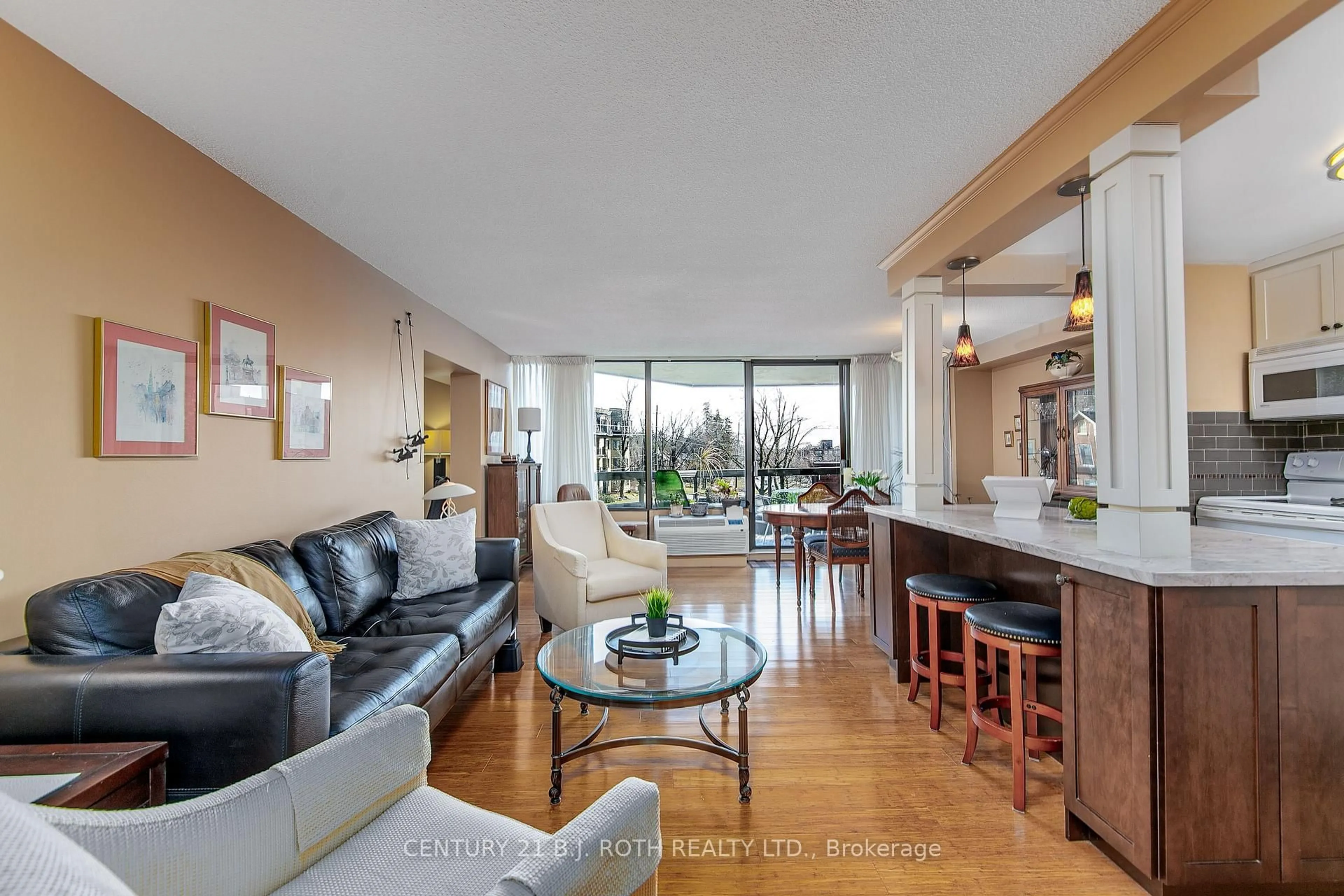 Living room with furniture, unknown for 181 Collier St #301, Barrie Ontario L4M 5L6