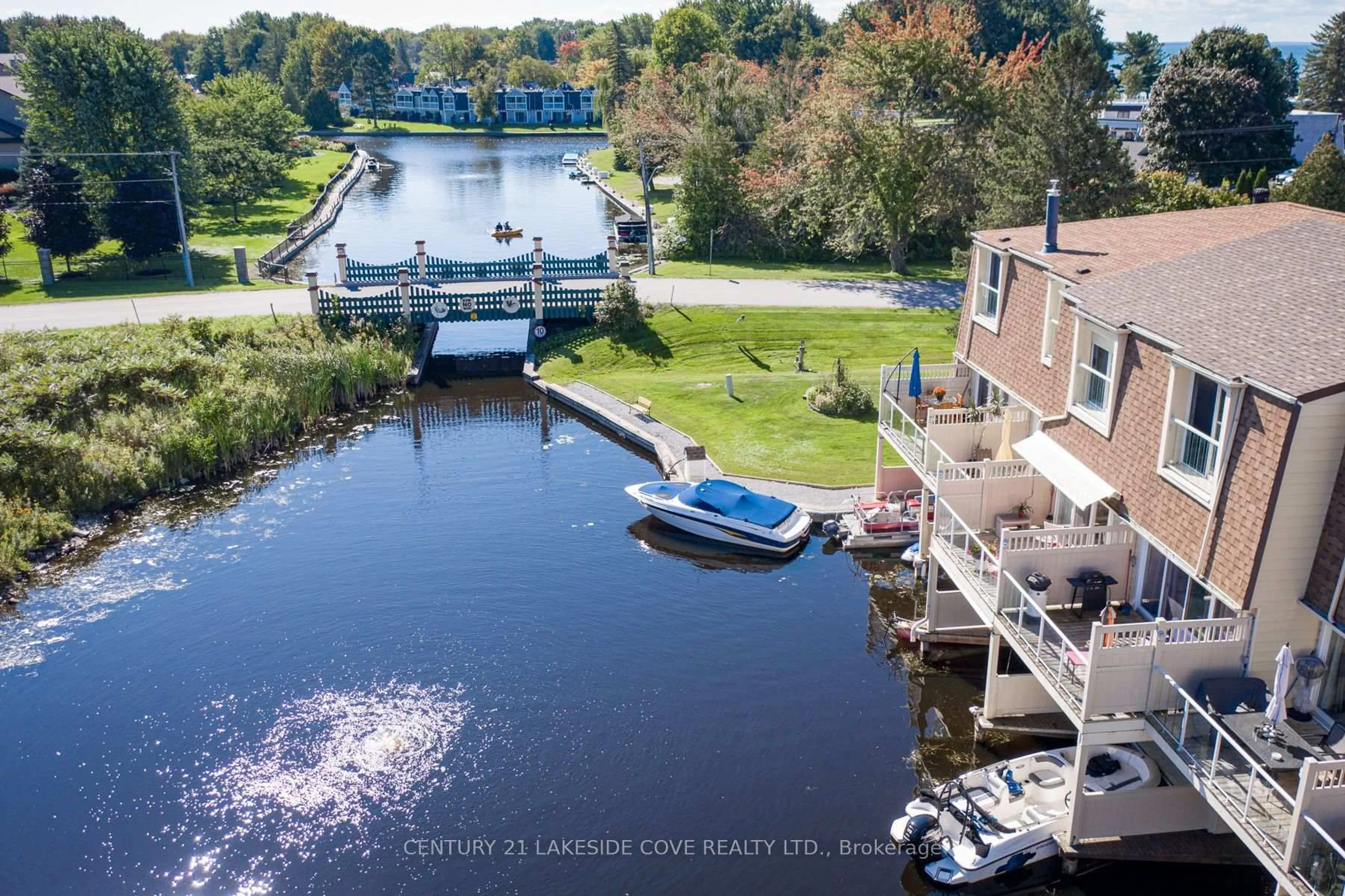 A pic from outside/outdoor area/front of a property/back of a property/a pic from drone, water/lake/river/ocean view for 4 Paradise Blvd #Unit #6, Ramara Ontario L0K 1B0