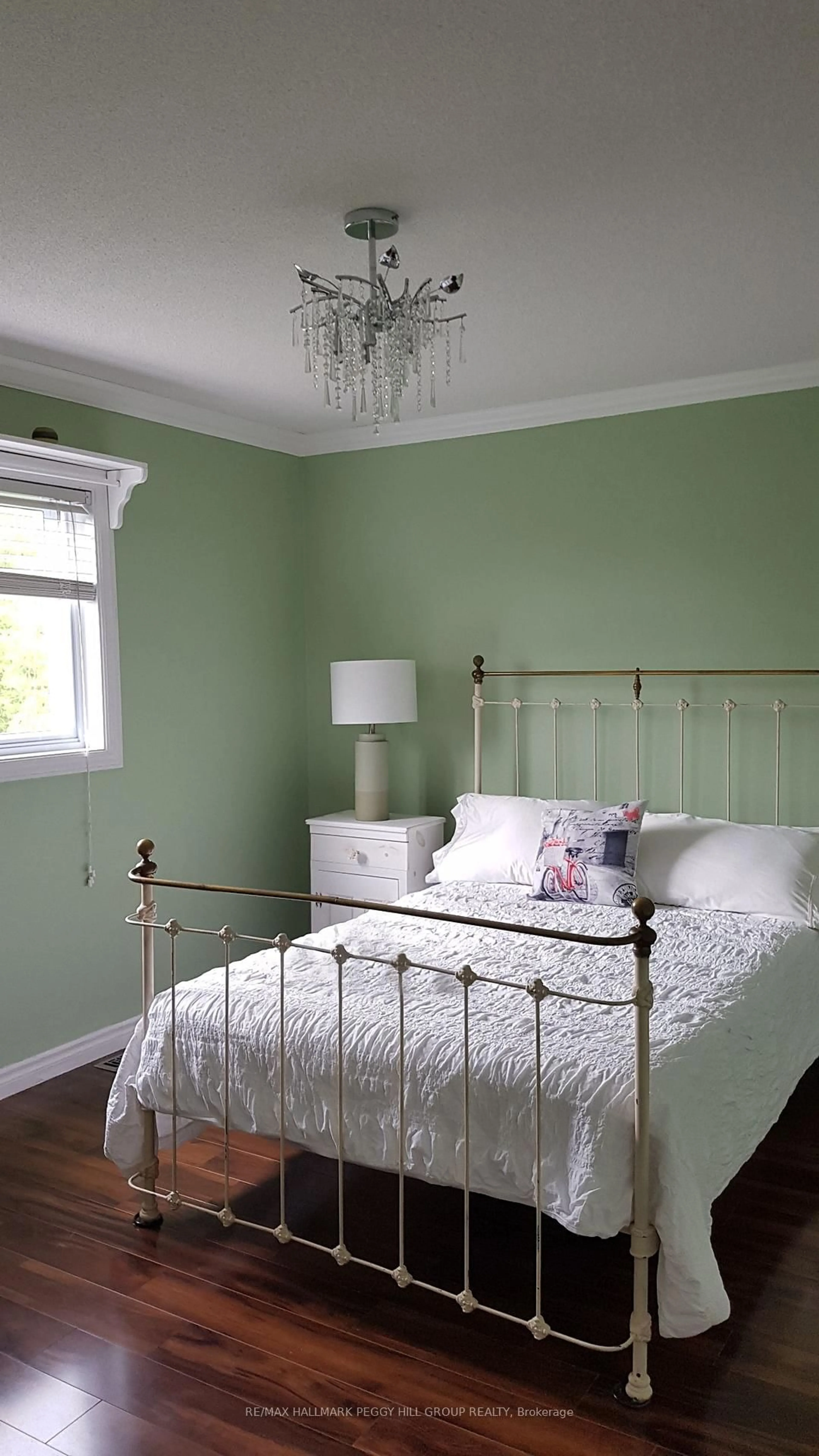 Bedroom with bed, wood/laminate floor for 76 Stanley St, Barrie Ontario L4M 6V5