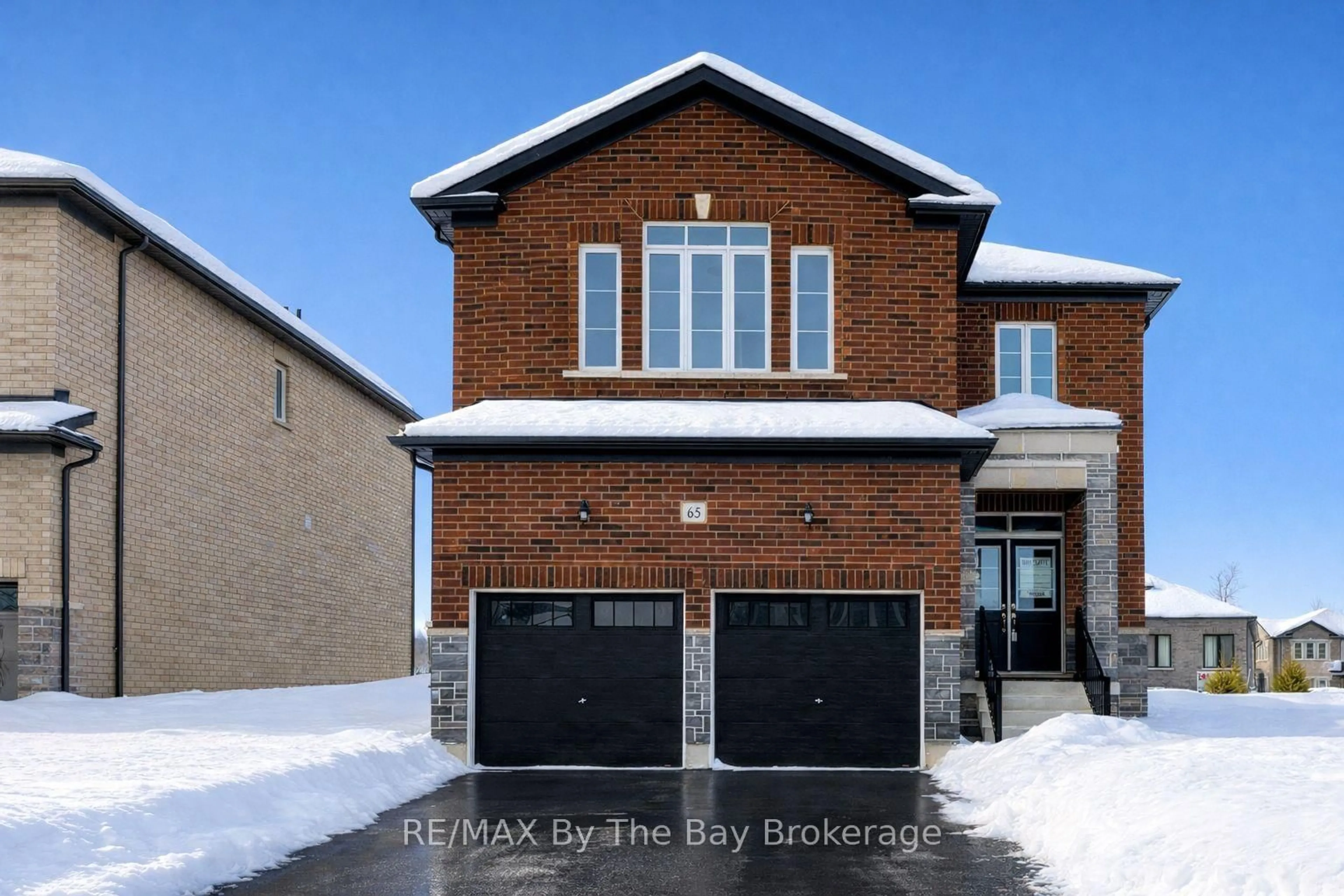 Home with brick exterior material, street for 65 Amber Dr, Wasaga Beach Ontario L9Z 0R9