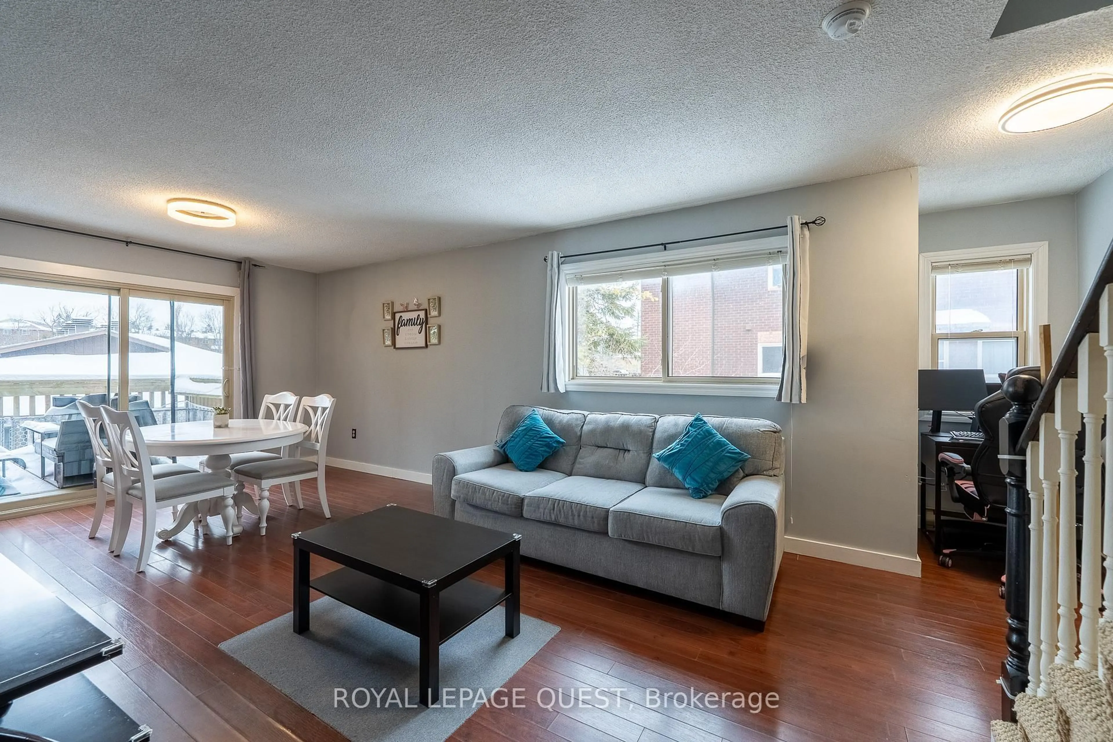 Living room with furniture, wood/laminate floor for 23 Meadow Lane #7, Barrie Ontario L4N 7K3
