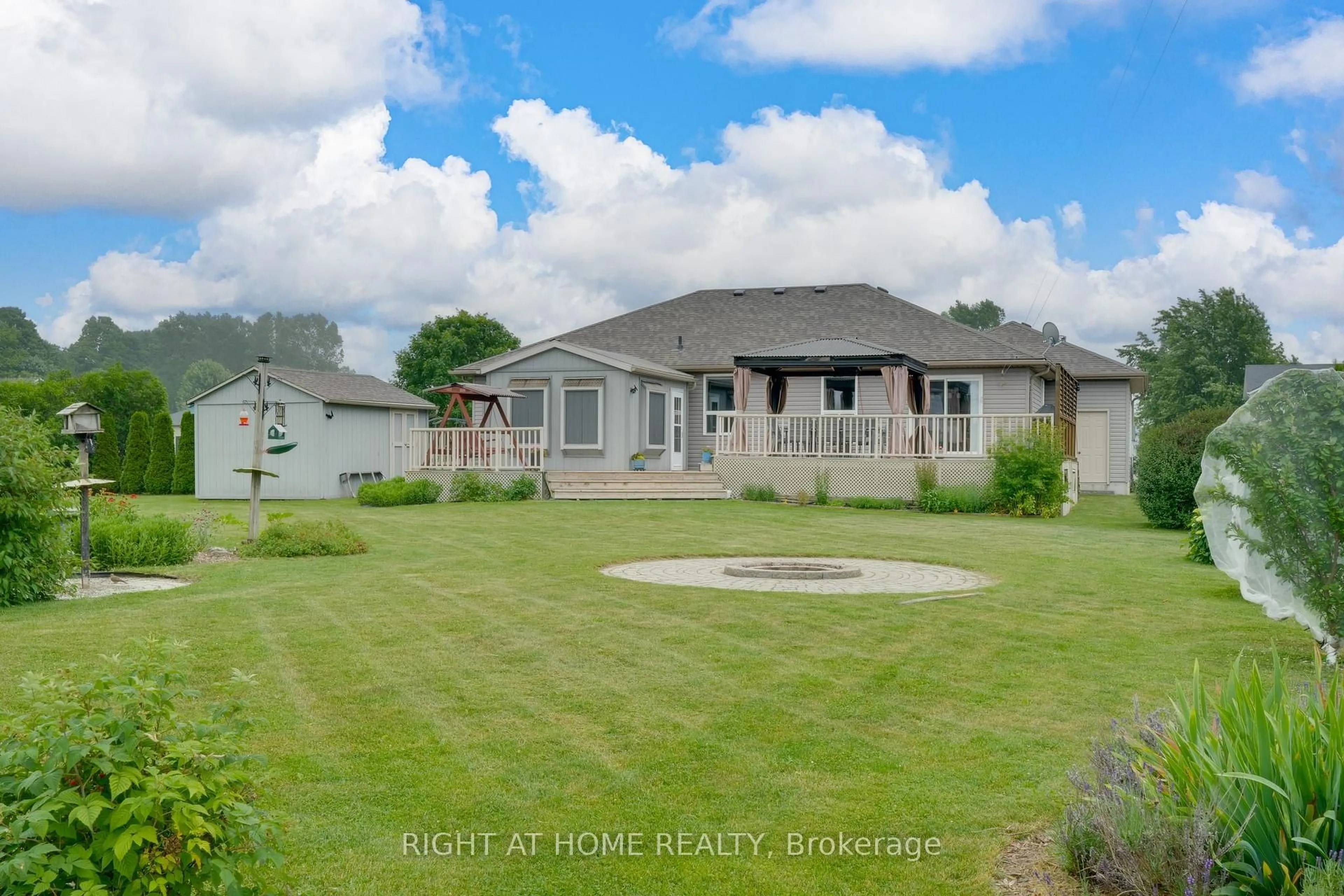 A pic from outside/outdoor area/front of a property/back of a property/a pic from drone, water/lake/river/ocean view for 16 O'neill Circ, Springwater Ontario L0L 2K0