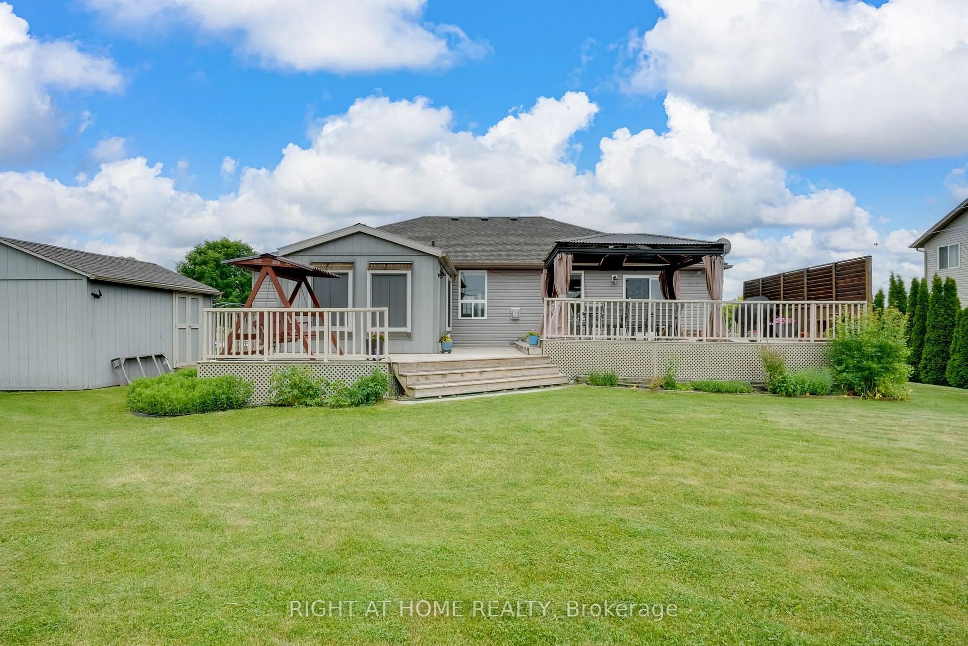 A pic from outside/outdoor area/front of a property/back of a property/a pic from drone, street for 16 O'neill Circ, Springwater Ontario L0L 2K0