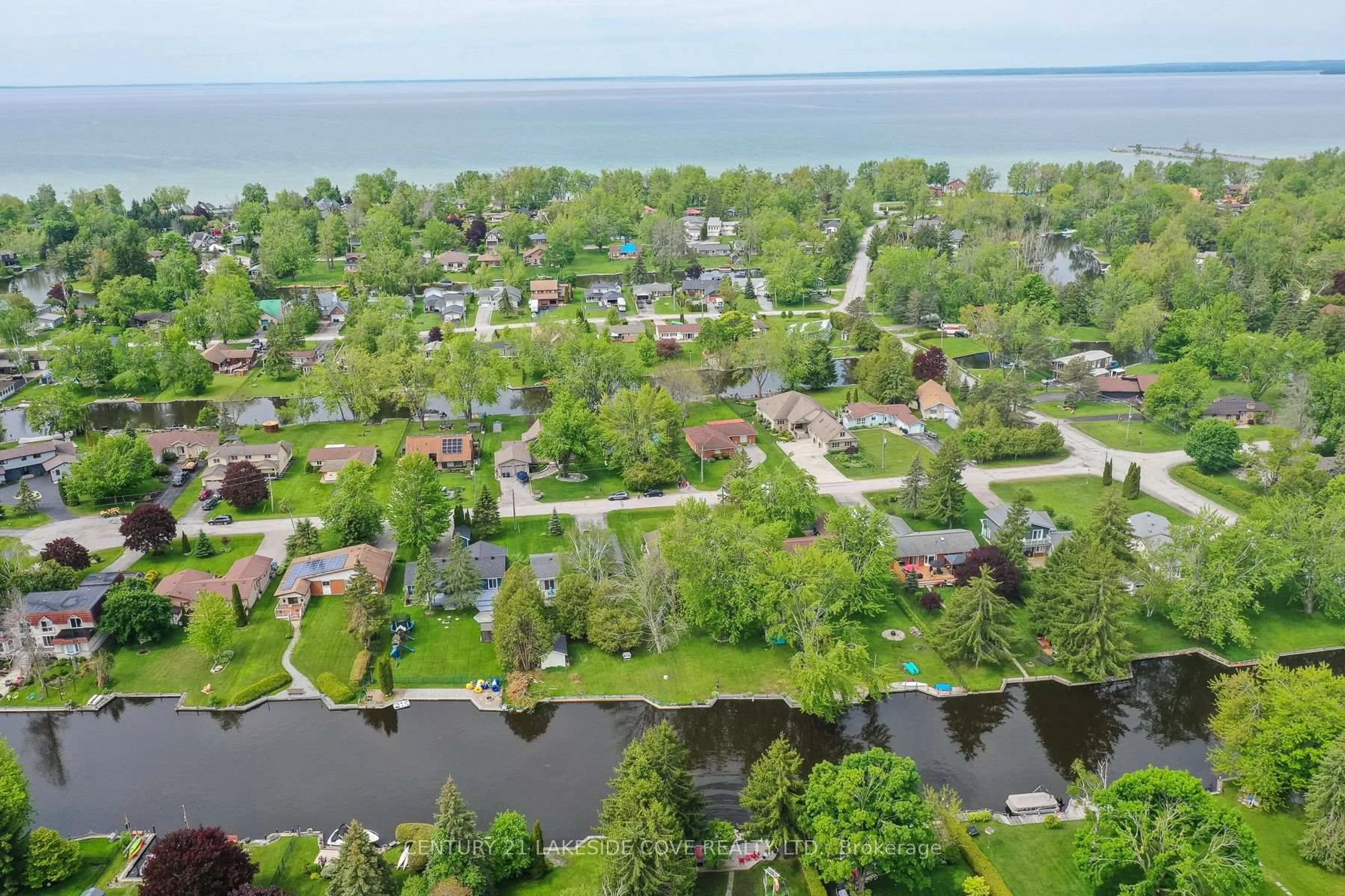 A pic from outside/outdoor area/front of a property/back of a property/a pic from drone, water/lake/river/ocean view for 9 Pinetree Crt, Ramara Ontario L0K 1B0