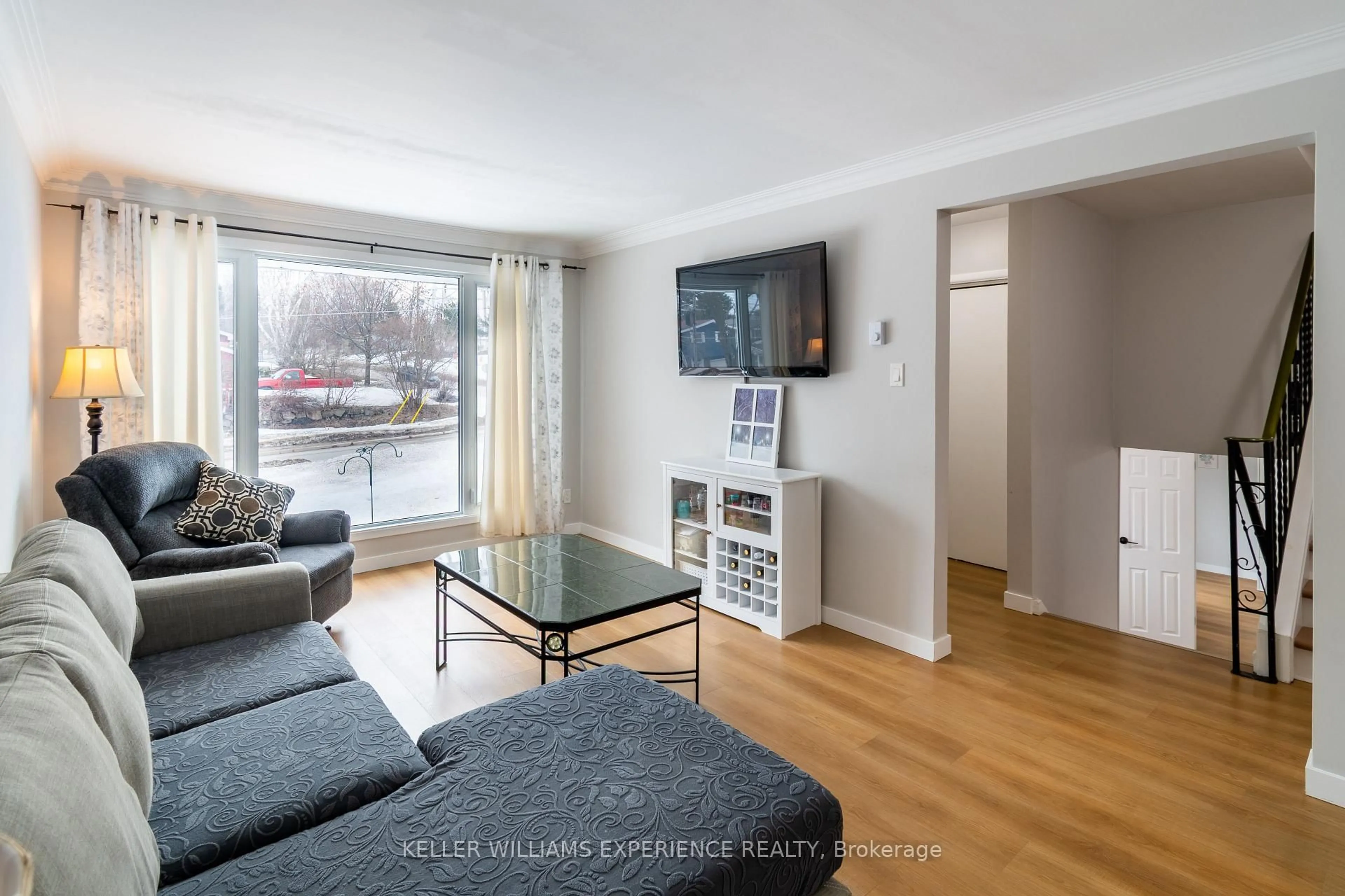 Living room with furniture, wood/laminate floor for 588 Manly St, Midland Ontario L4R 3G3