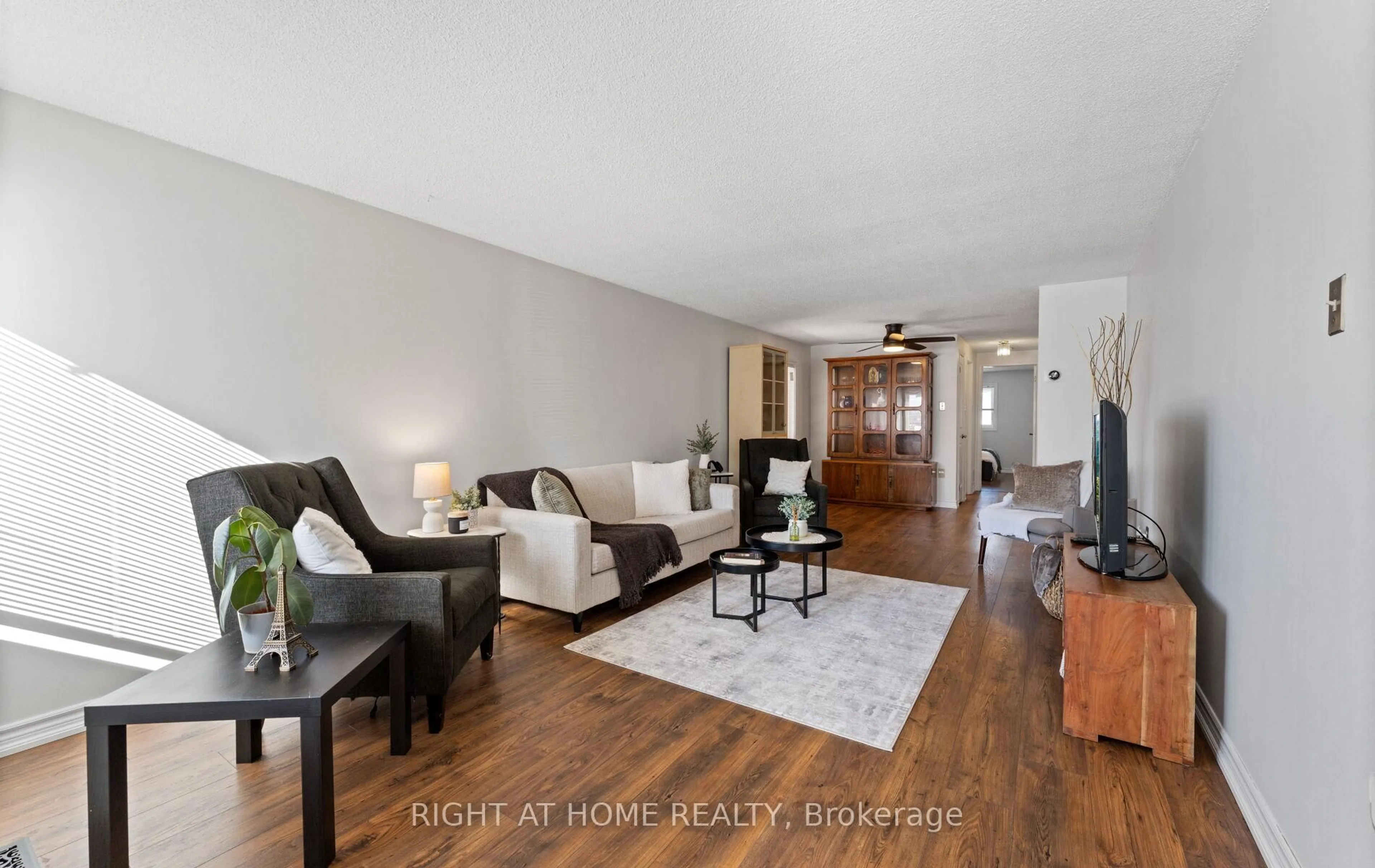 Living room with furniture, wood/laminate floor for 56 Ferguson Dr, Barrie Ontario L4N 7B5