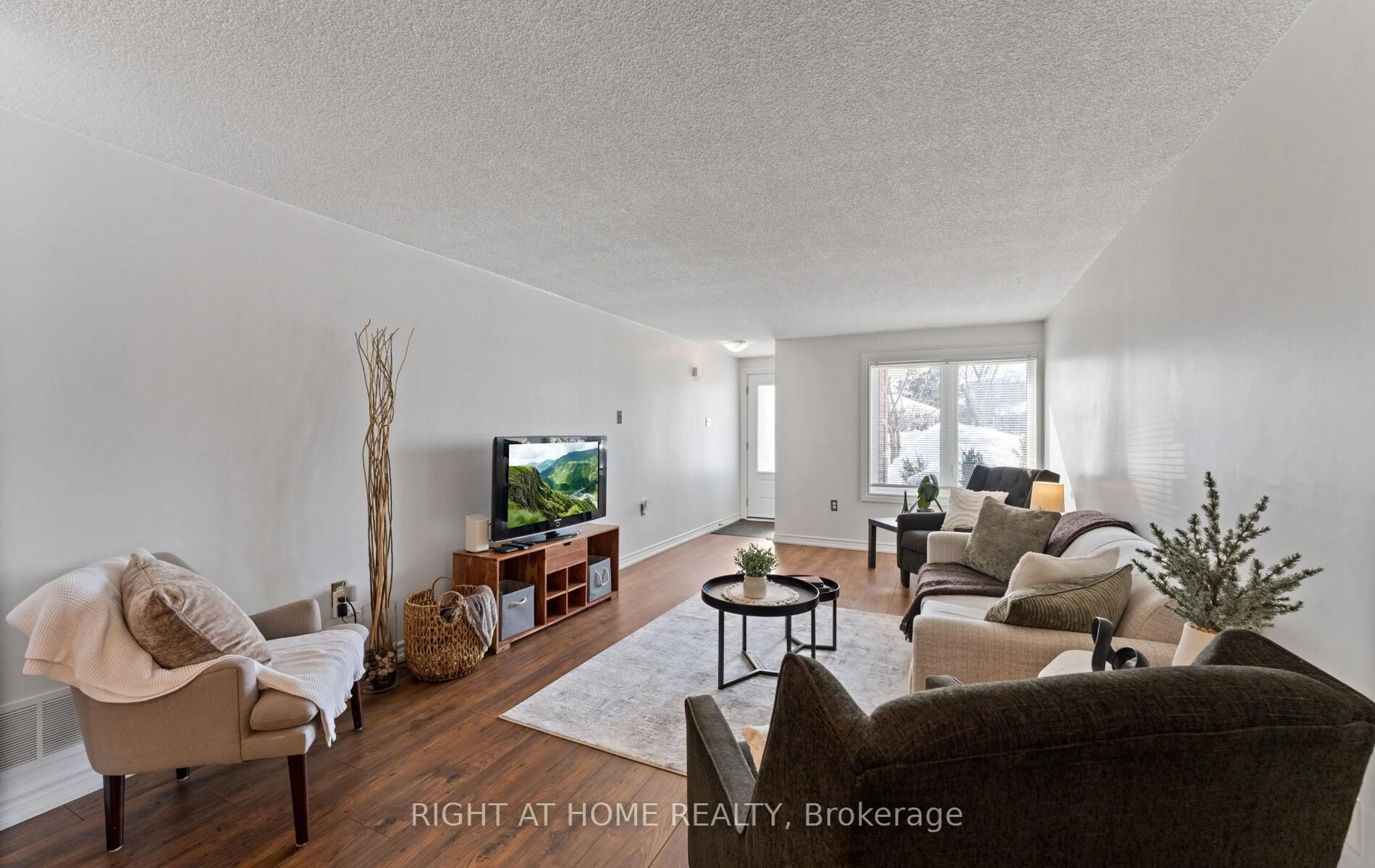 Living room with furniture, wood/laminate floor for 56 Ferguson Dr, Barrie Ontario L4N 7B5