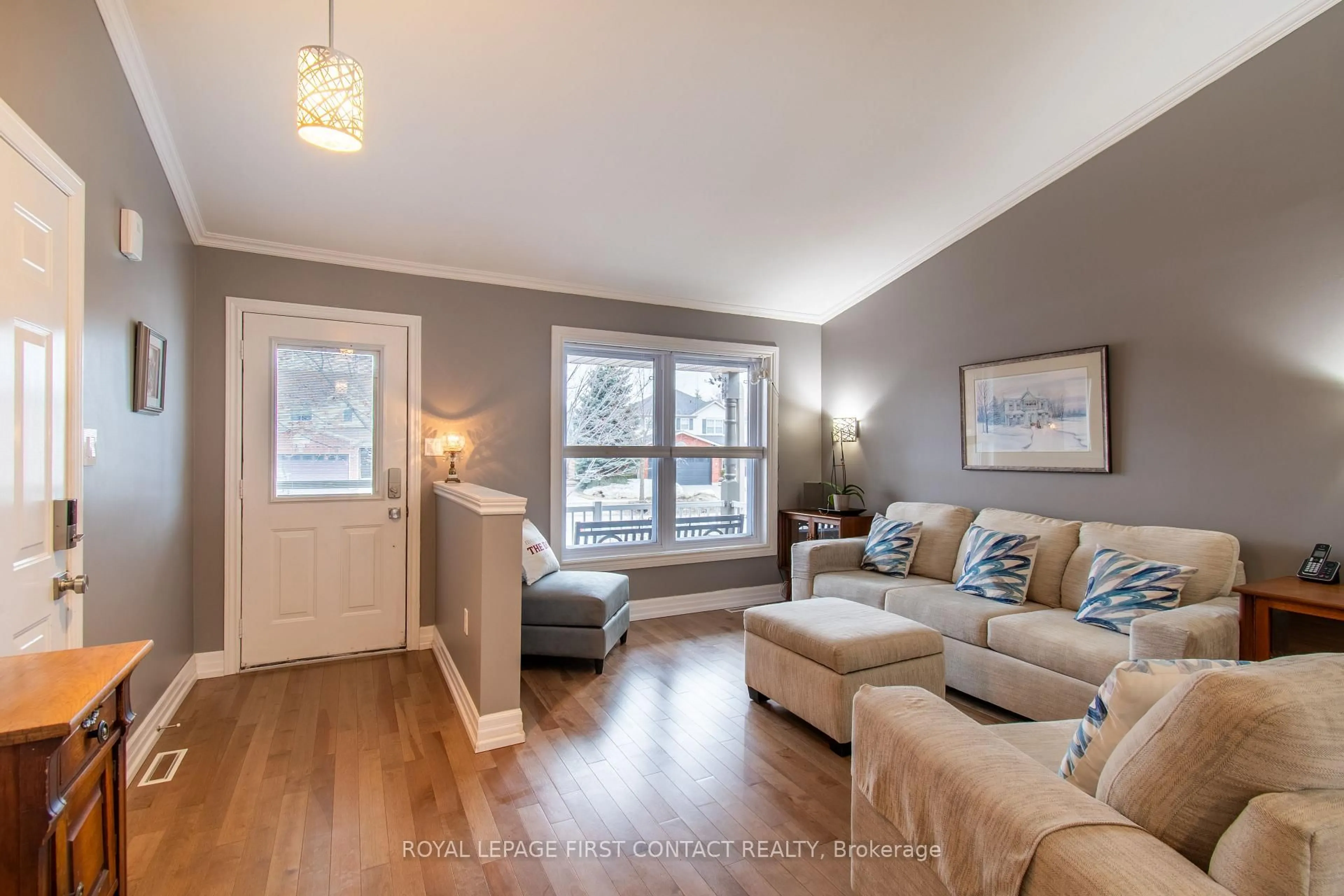 Living room with furniture, wood/laminate floor for 249 Esther Dr, Barrie Ontario L4N 0G3