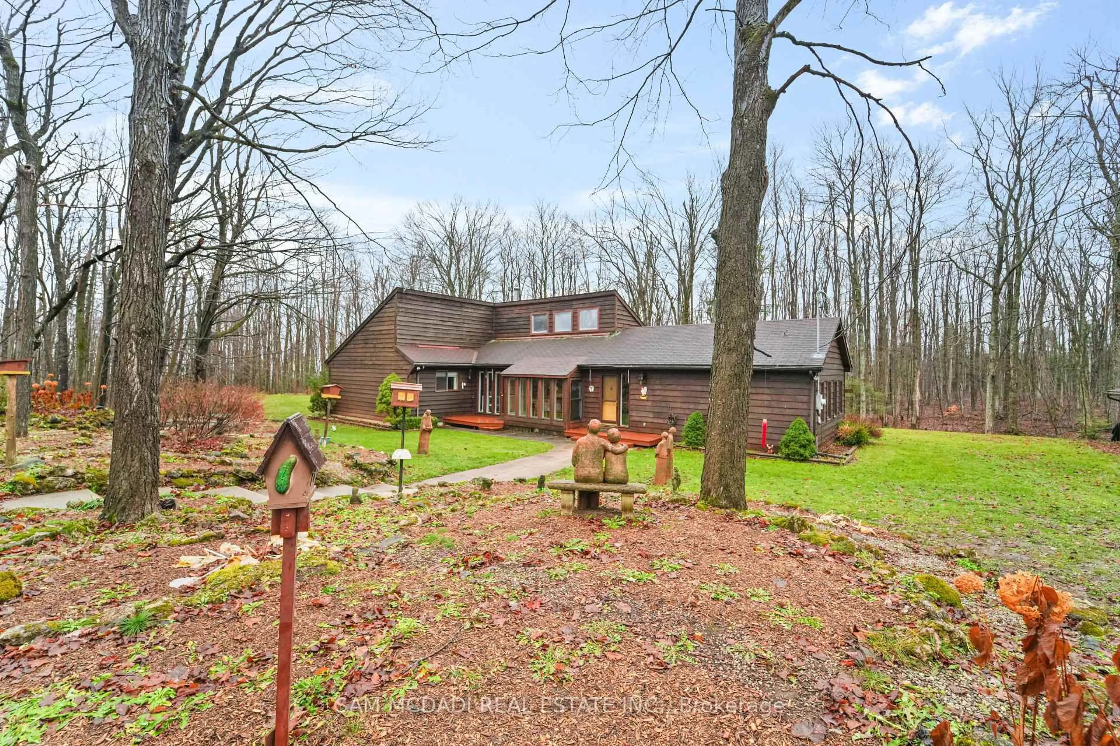 A pic from outside/outdoor area/front of a property/back of a property/a pic from drone, forest/trees view for 1415 County Rd 124, Clearview Ontario L0M 1H0