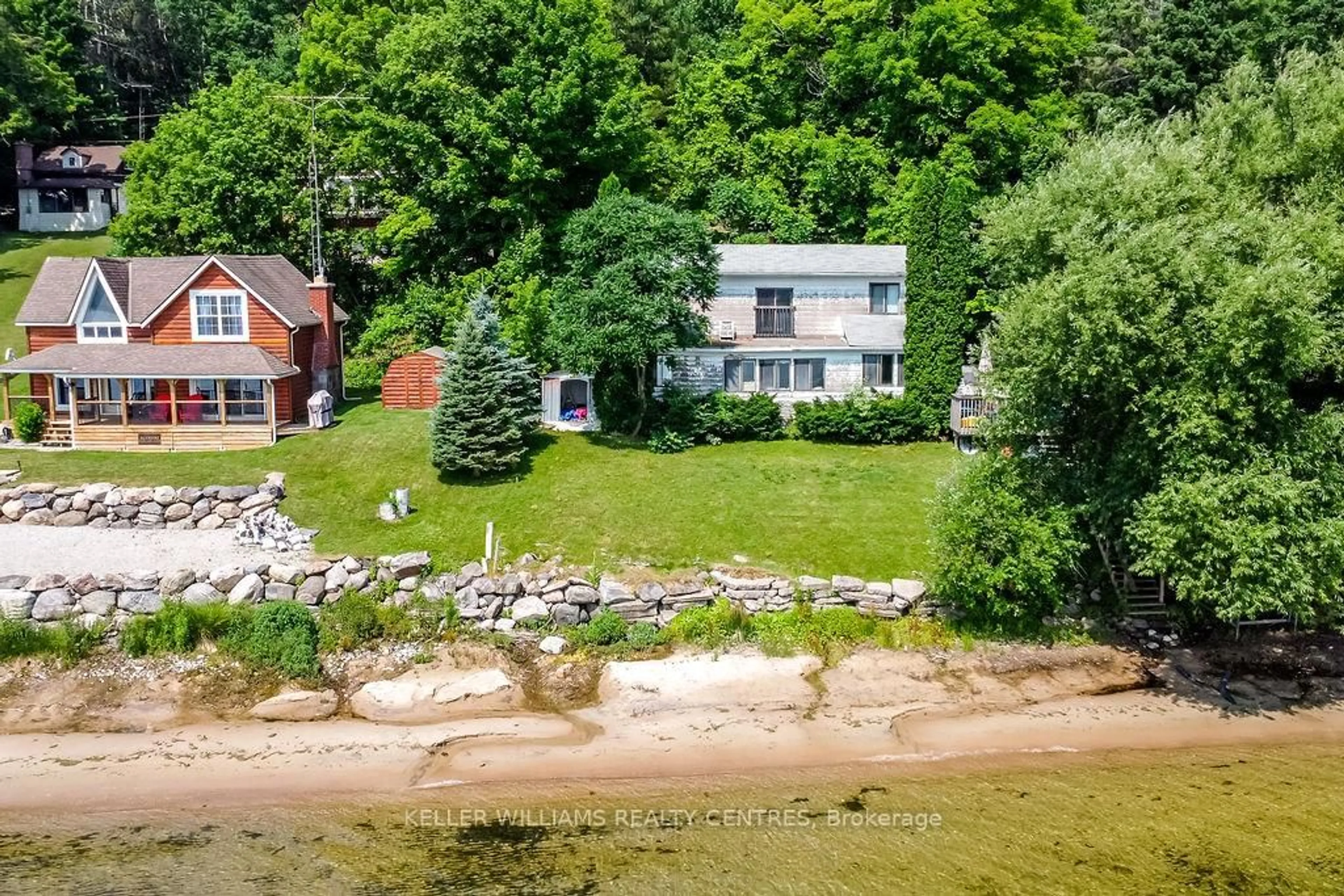 A pic from outside/outdoor area/front of a property/back of a property/a pic from drone, water/lake/river/ocean view for 379 Champlain Rd, Penetanguishene Ontario L9M 1S3