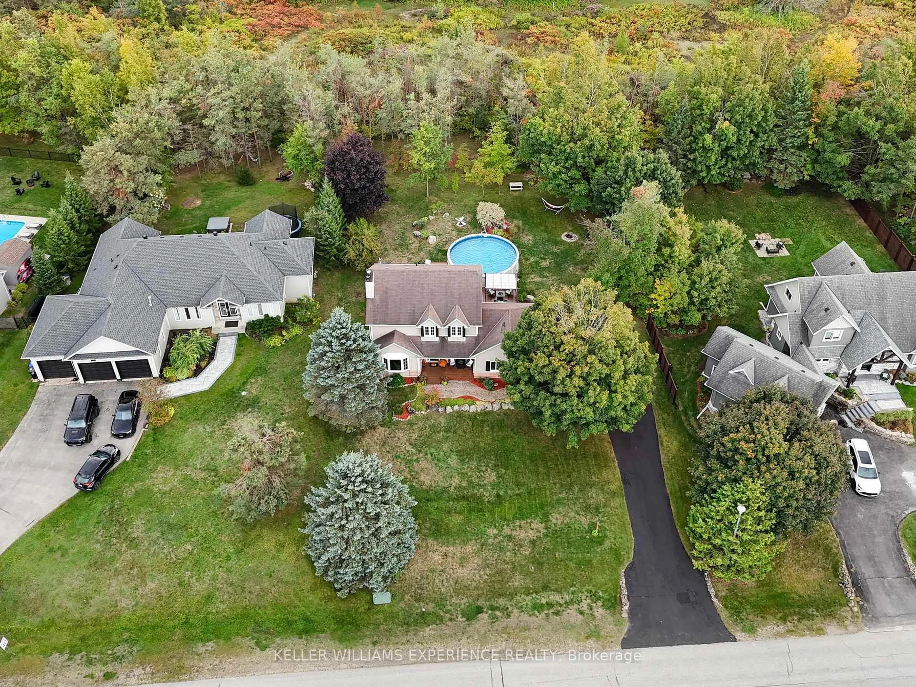 A pic from outside/outdoor area/front of a property/back of a property/a pic from drone, street for 99 Highland Dr, Oro-Medonte Ontario L0L 2L0