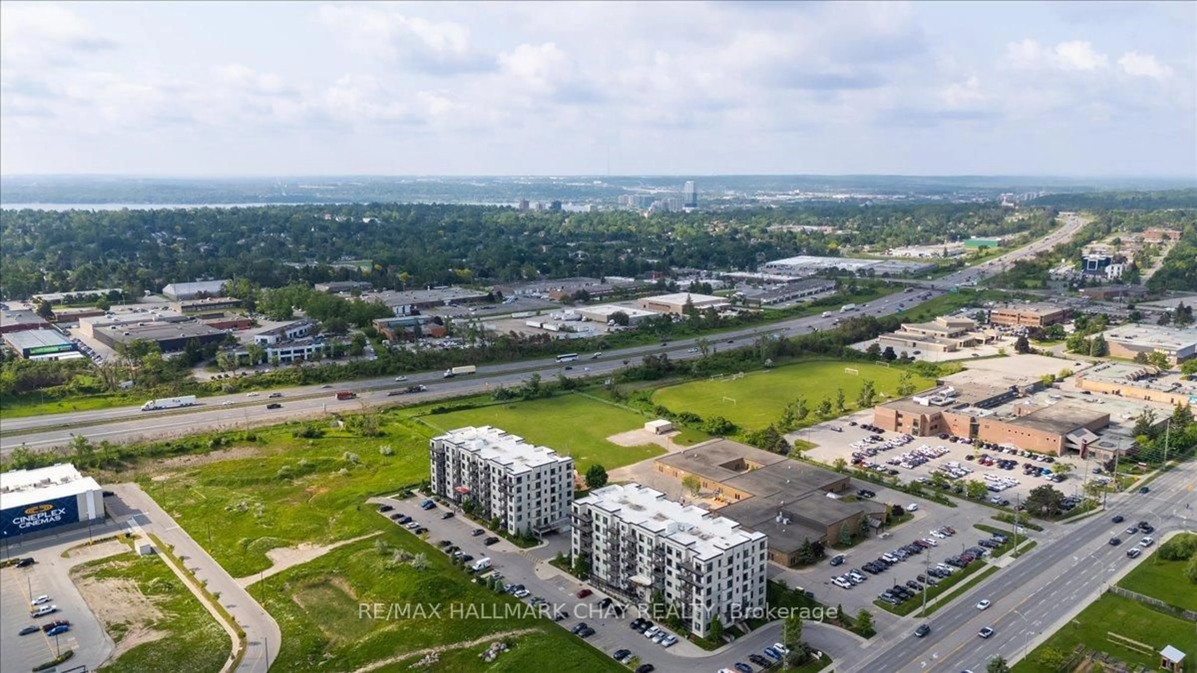 A pic from outside/outdoor area/front of a property/back of a property/a pic from drone, unknown for 299 Cundles Rd #610, Barrie Ontario L4M 5J7