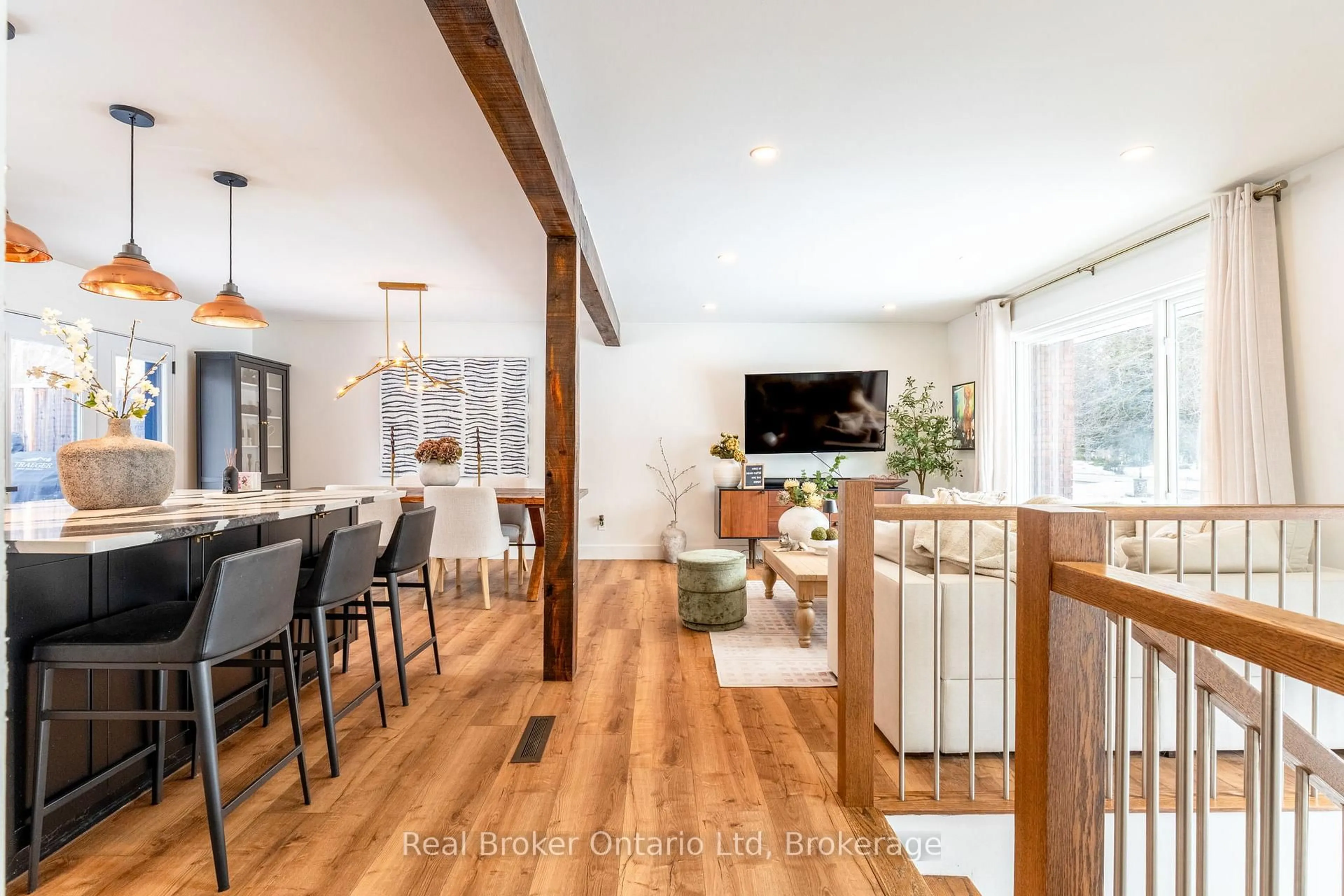 Open concept kitchen, wood/laminate floor for 3922 Horseshoe Valley Rd, Springwater Ontario L0L 1Y0