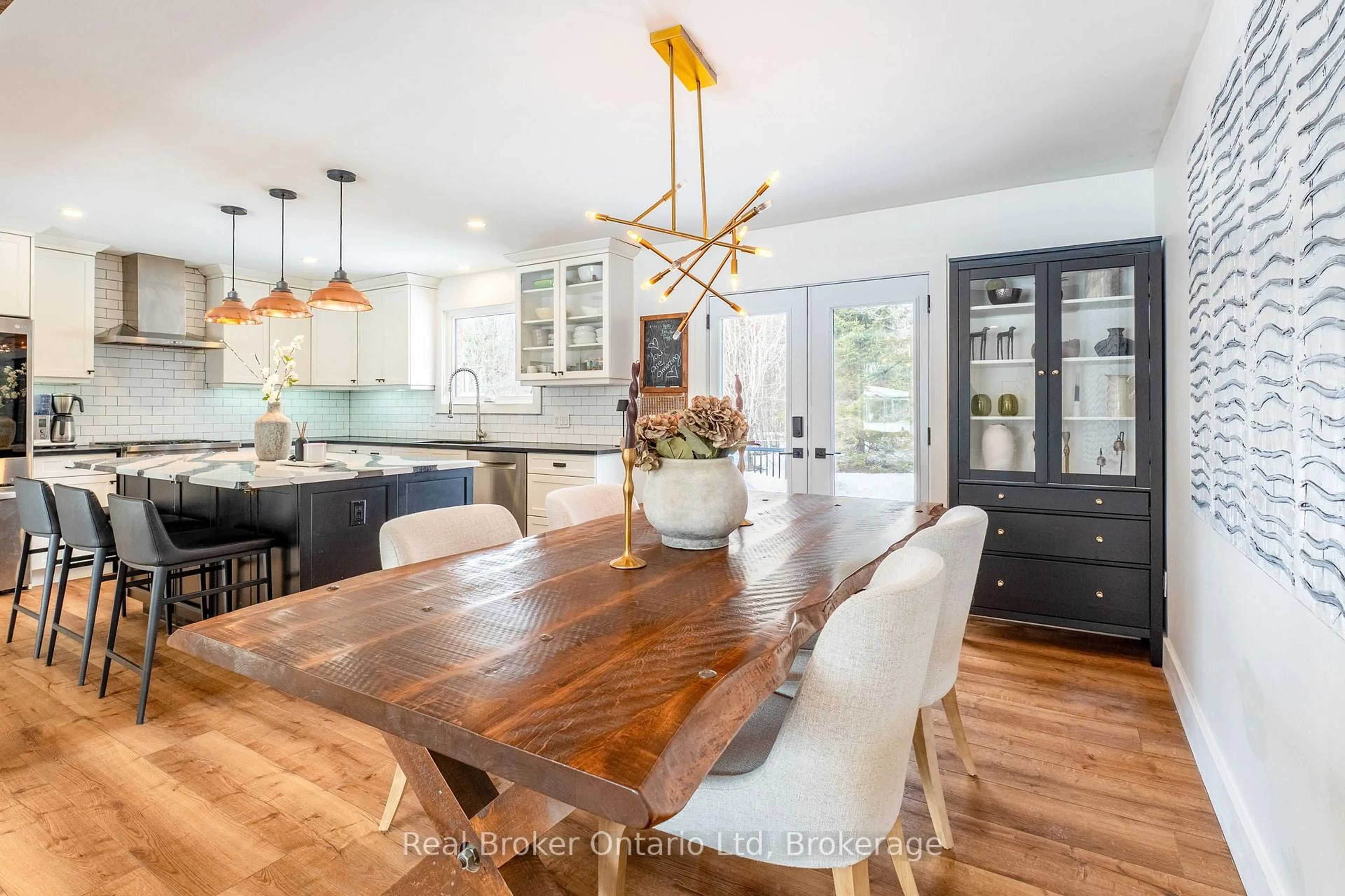 Open concept kitchen, wood/laminate floor for 3922 Horseshoe Valley Rd, Springwater Ontario L0L 1Y0