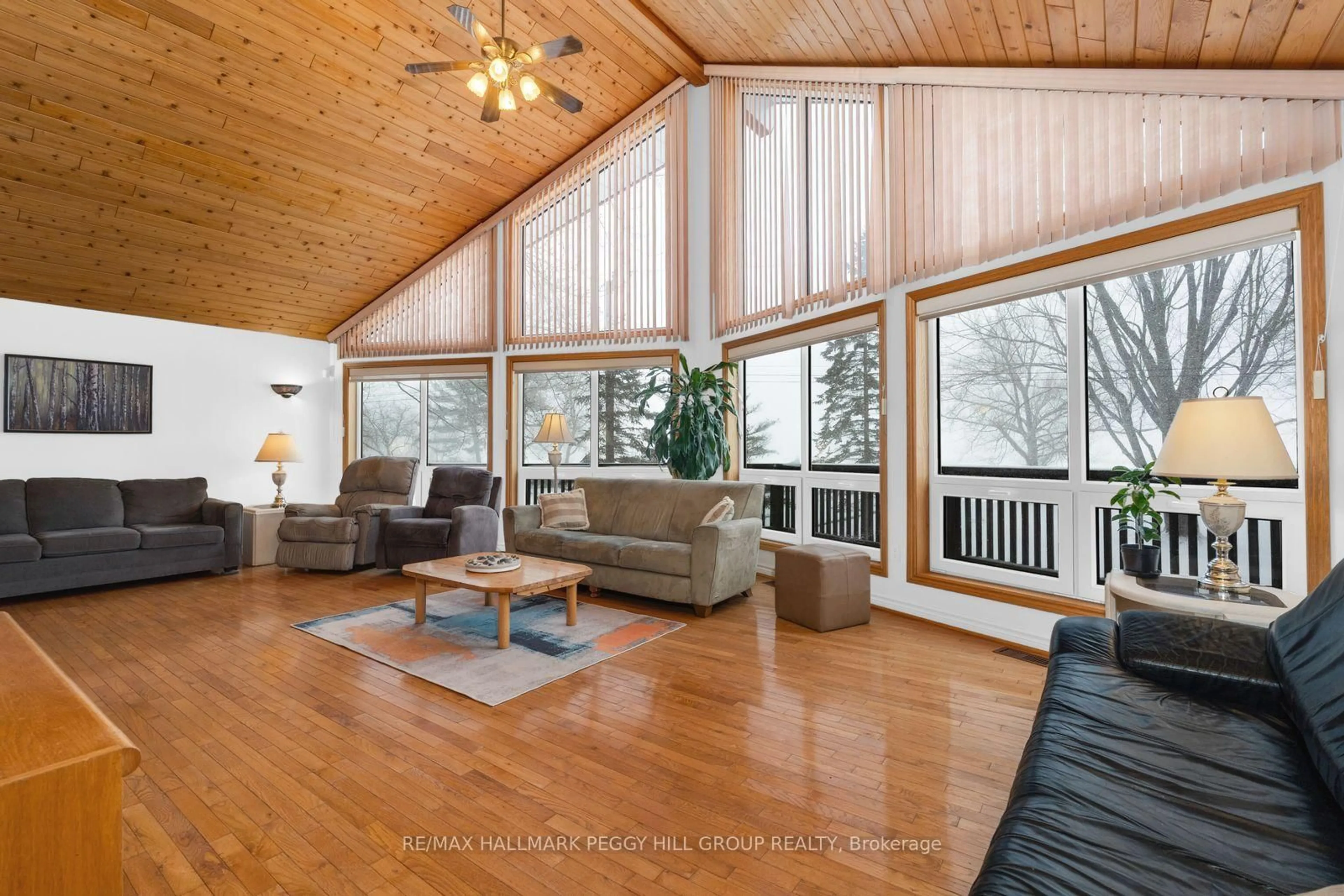 Living room with furniture, wood/laminate floor for 172 Duck Bay Rd, Tay Ontario L0K 2C0