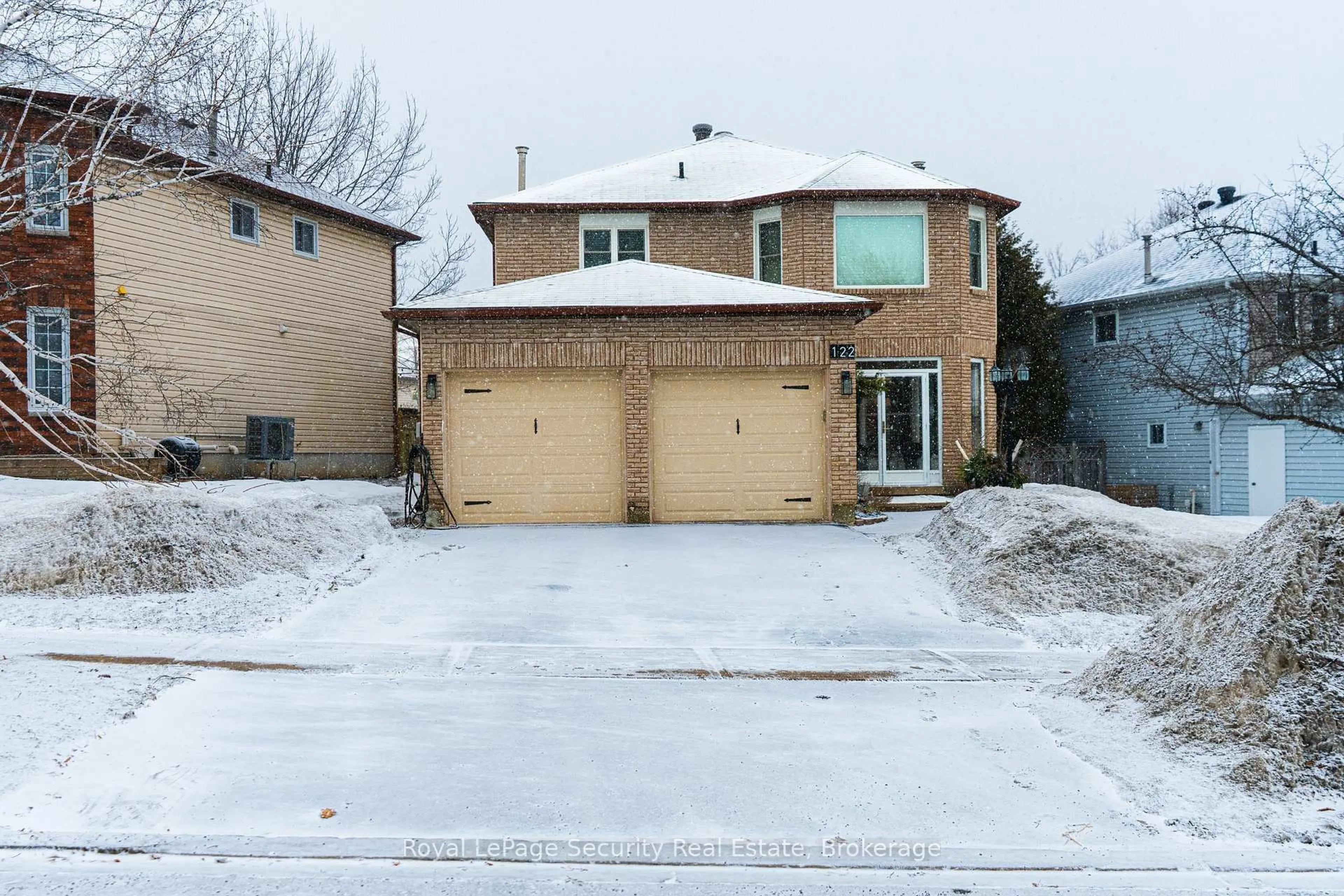 Home with brick exterior material, street for 122 Browning Tr, Barrie Ontario L4N 6R3