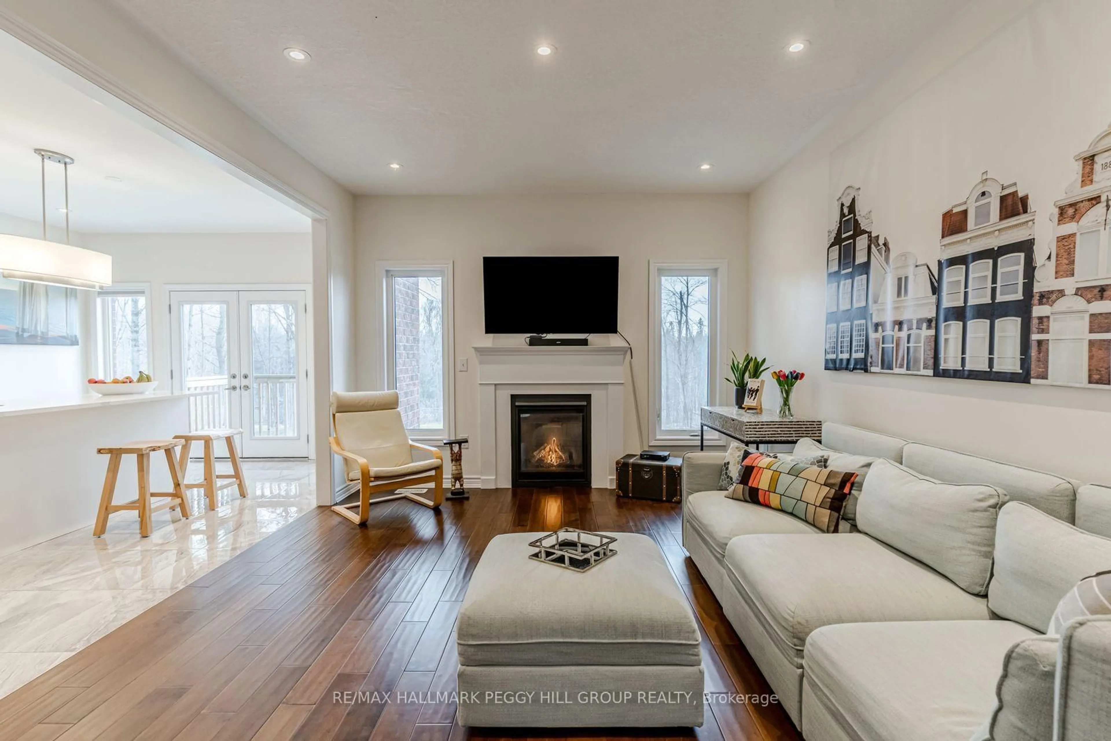 Living room with furniture, wood/laminate floor for 82 Diamond Valley Dr, Oro-Medonte Ontario L0L 2E0