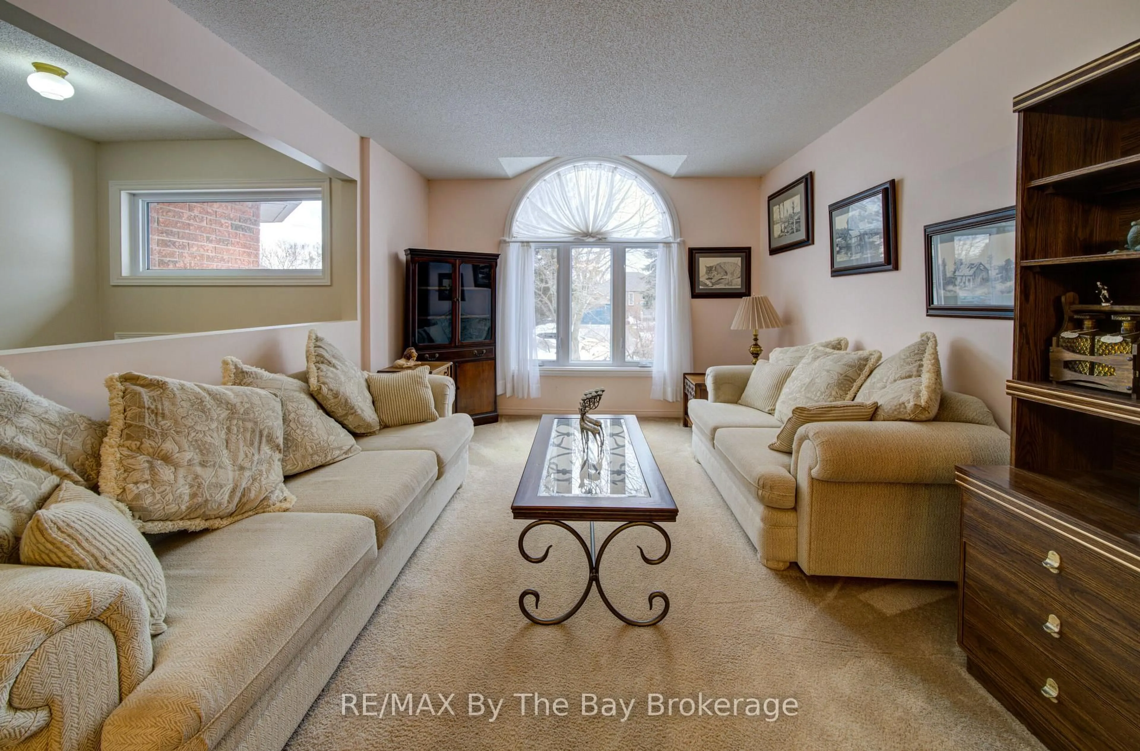 Living room with furniture, ceramic/tile floor for 26 Brouwer Cres, Wasaga Beach Ontario L9Z 1L8